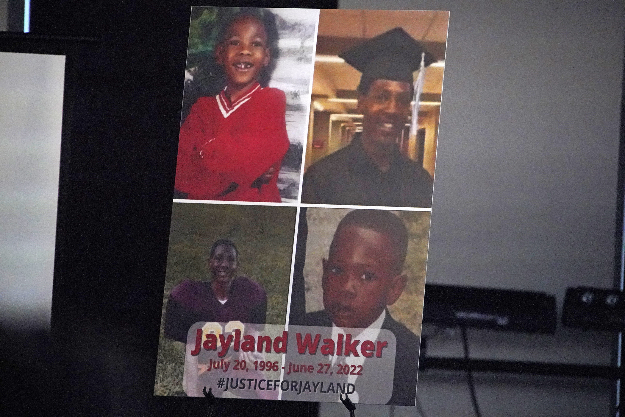 FILE - This is a poster on the stage during a news conference following the funeral service for Jayland Walker at the Akron Civic Center in Akron, Ohio, July 13, 2022. A grand jury in Ohio will hear evidence this week to decide whether police officers should face criminal charges in the shooting of Jayland Walker, a 25-year-old Black man whose death sparked protests in Akron last summer. (AP Photo/Gene J. Puskar, File)