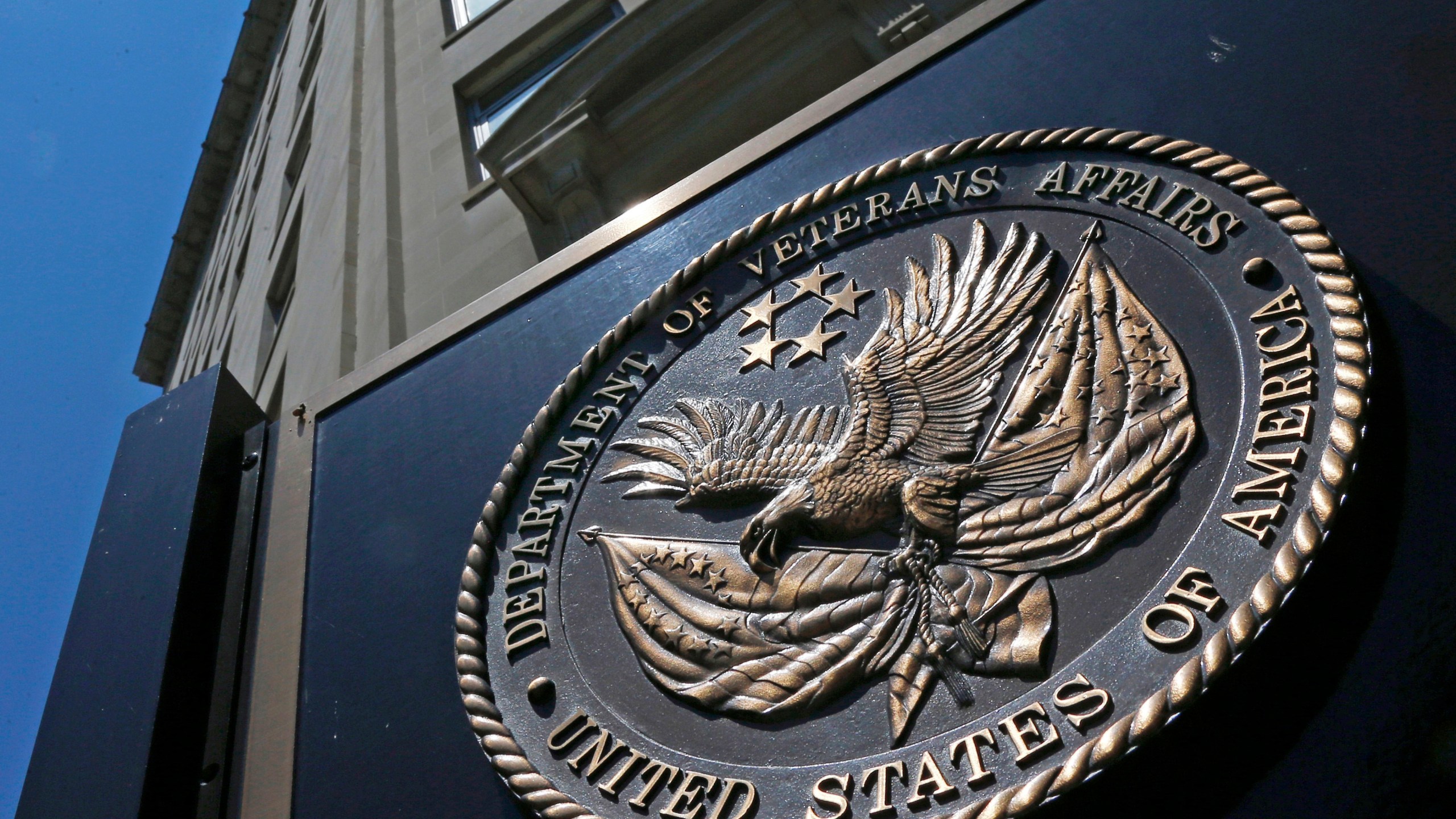 FILE - This June 21, 2013, file photo, shows the seal affixed to the front of the Department of Veterans Affairs building in Washington. The federal government wrote duplicate checks to doctors who provided care for veterans, costing taxpayers $128 million in extra payments over the last five years, according to a new watchdog report out this week. In nearly 300,000 cases, private doctors were paid twice – once by the Veterans Health Administration and another time by Medicare – for the same care provided to veterans from 2017 to 2021, the Health and Human Services Office of Inspector General found in its report. (AP Photo/Charles Dharapak, File)