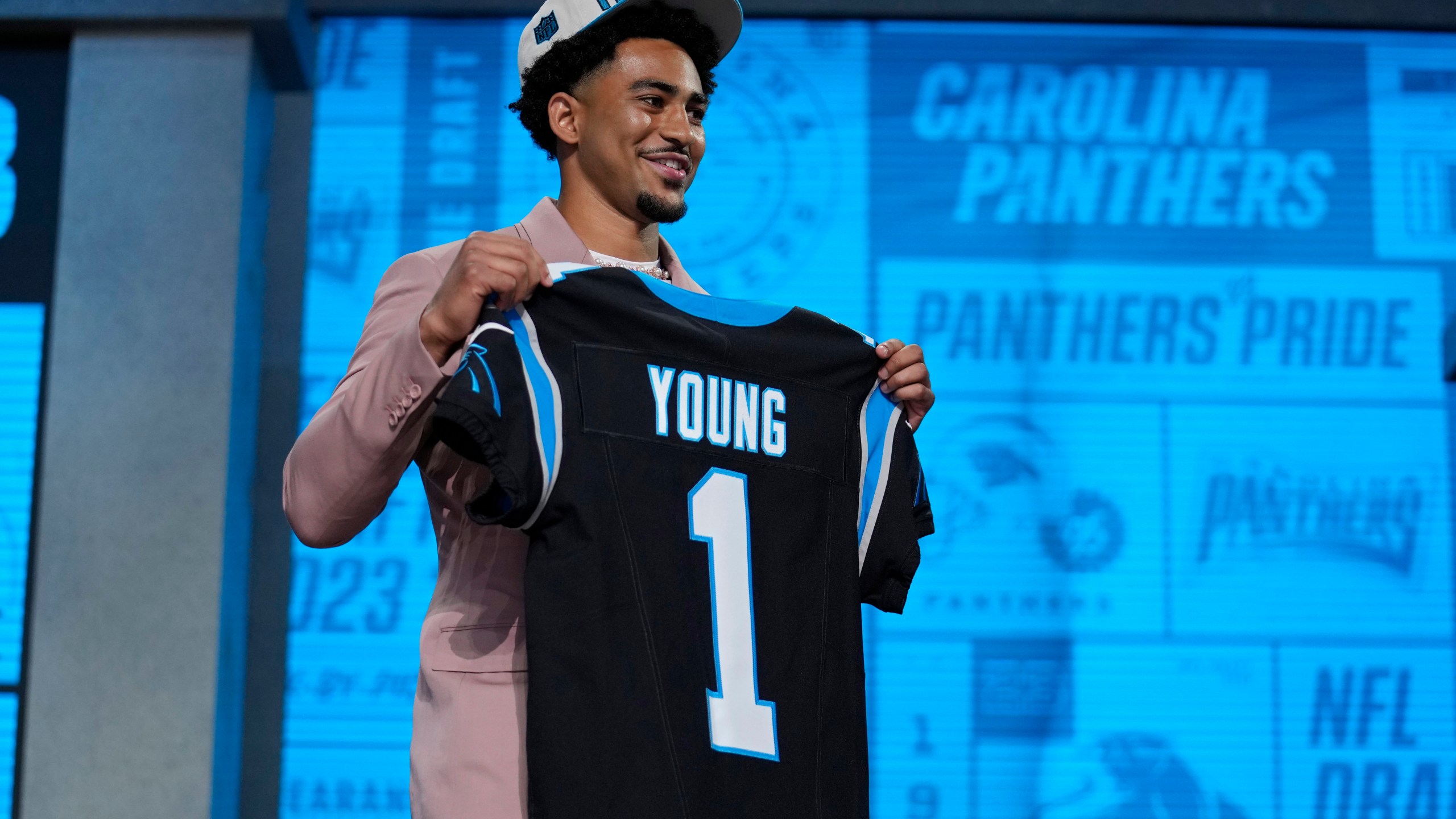 Alabama quarterback Bryce Young poses after being chosen by Carolina Panthers with the first overall pick during the first round of the NFL football draft, Thursday, April 27, 2023, in Kansas City, Mo. (AP Photo/Jeff Roberson)