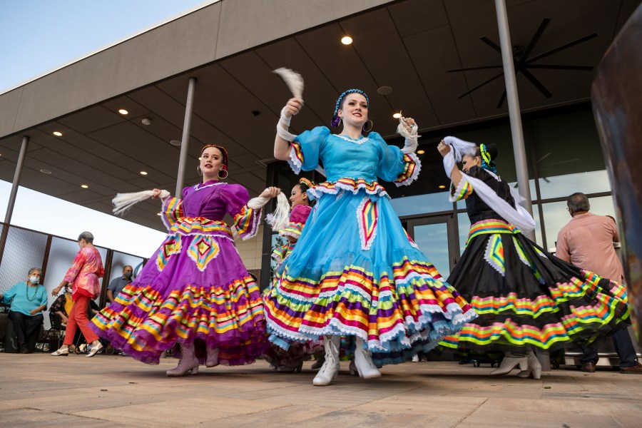 FILE -Young Folklorico dancers from the group Viva Mexico begin their dance routine at a Cinco de Mayo celebration hosted by the Odessa Hispanic Chamber of Commerce at the Odessa Marriott Hotel and Convention Center, Wednesday, May 5, 2021, in Odessa, Texas. American bars and restaurants gear up every year for Cinco de Mayo, offering special deals on Mexican food and alcoholic drinks for the May 5 holiday that is barely celebrated south of the border. (Eli Hartman/Odessa American via AP, File)