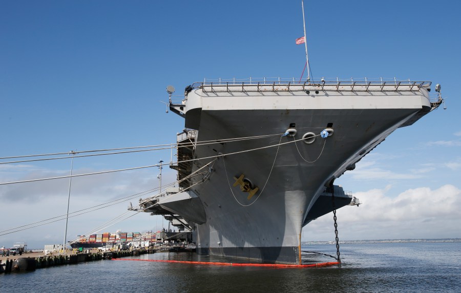 FILE - The nuclear aircraft carrier USS George Washington pier side at Norfolk Naval Station in Norfolk, Va., Sept. 30, 2016. A Navy investigation triggered by a series of suicides is recommending widespread improvements in housing, food, parking and internet for sailors, as well as changes to mental health and other personnel programs. The investigation began last year after seven service members assigned to the aircraft carrier USS George Washington died over a 12-month period ending April 2022, including three in one week. The carrier was docked for overhaul at Newport News shipyard. (AP Photo/Steve Helber, File)