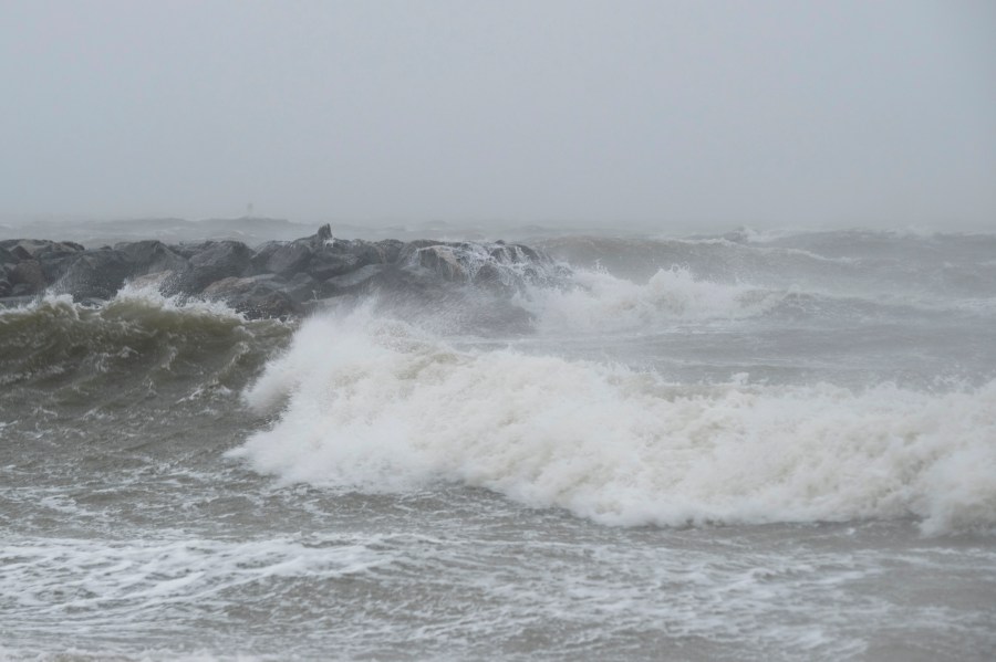 FILE - Waves crash at Outlook Beach in Hampton, Va., Sept. 30, 2022. Storms with strong gusting winds sometimes cause a phenomenon known as a meteotsunami, in which the winds push on the water and increase the wave height near the coast before it eventually crashes onto shore. (Billy Schuerman/The Virginian-Pilot via AP, File)