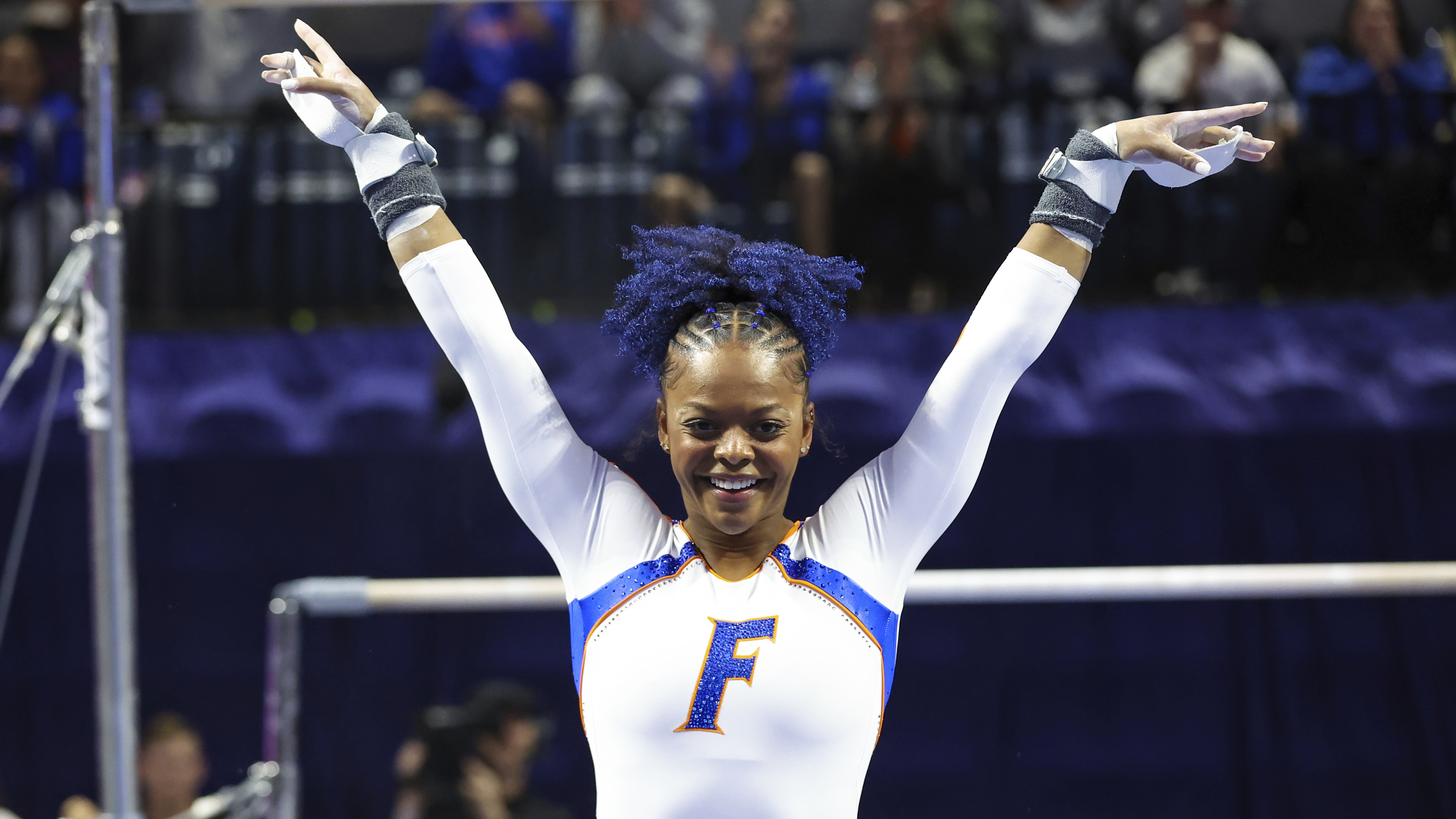 FILE - Florida's Trinity Thomas reacts after competing on the uneven bars during an NCAA gymnastics meet against Georgia on Friday, Jan. 27, 2023, in Gainesville, Fla. Thomas, the 2022 NCAA champion while competing for Florida, says she is going to make a bid for the 2024 U.S. women's Olympic gymnastics team. (AP Photo/Gary McCullough, File)