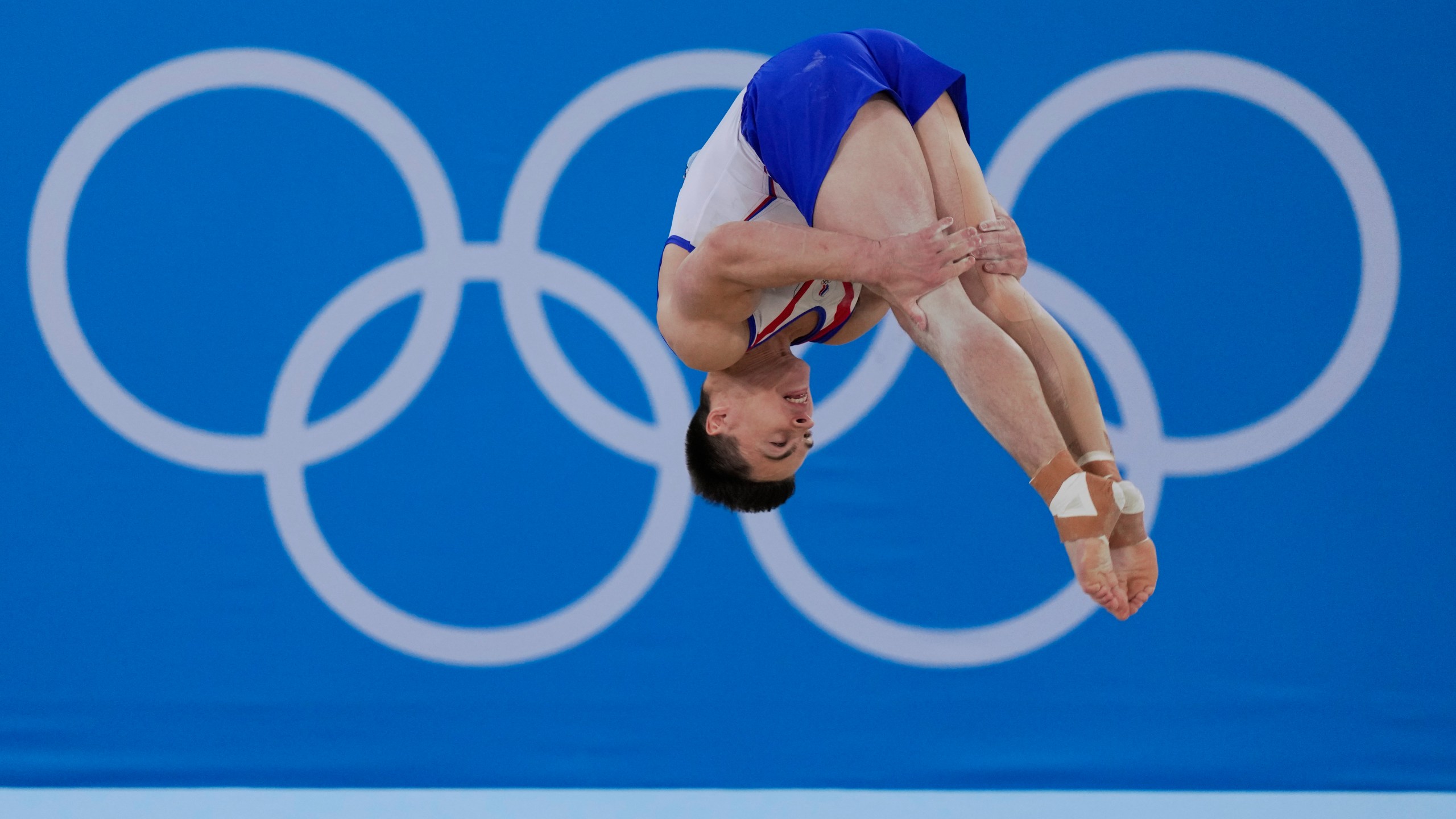 FILE - Nikita Nagornyy, of the Russian Olympic Committee, performs on the floor during the artistic gymnastic men's all-around final at the 2020 Summer Olympics, Wednesday, July 28, 2021, in Tokyo. A year out from the Paris Olympics, and nearly a year and a half since Russia's full-scale invasion of Ukraine, officials governing the many sports on the Olympic program are still split on how to treat Russian athletes. (AP Photo/Gregory Bull, File)