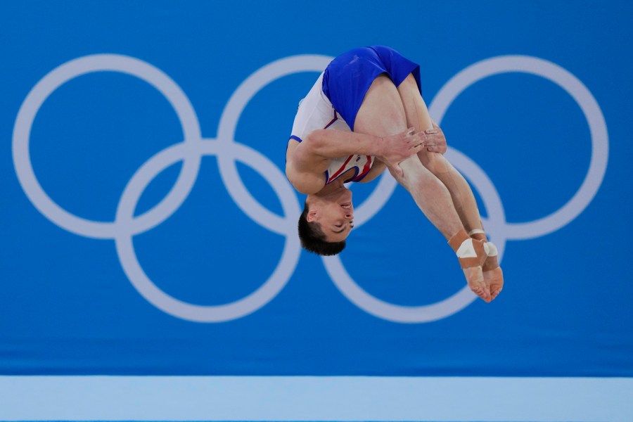 FILE - Nikita Nagornyy, of the Russian Olympic Committee, performs on the floor during the artistic gymnastic men's all-around final at the 2020 Summer Olympics, Wednesday, July 28, 2021, in Tokyo. A year out from the Paris Olympics, and nearly a year and a half since Russia's full-scale invasion of Ukraine, officials governing the many sports on the Olympic program are still split on how to treat Russian athletes. (AP Photo/Gregory Bull, File)