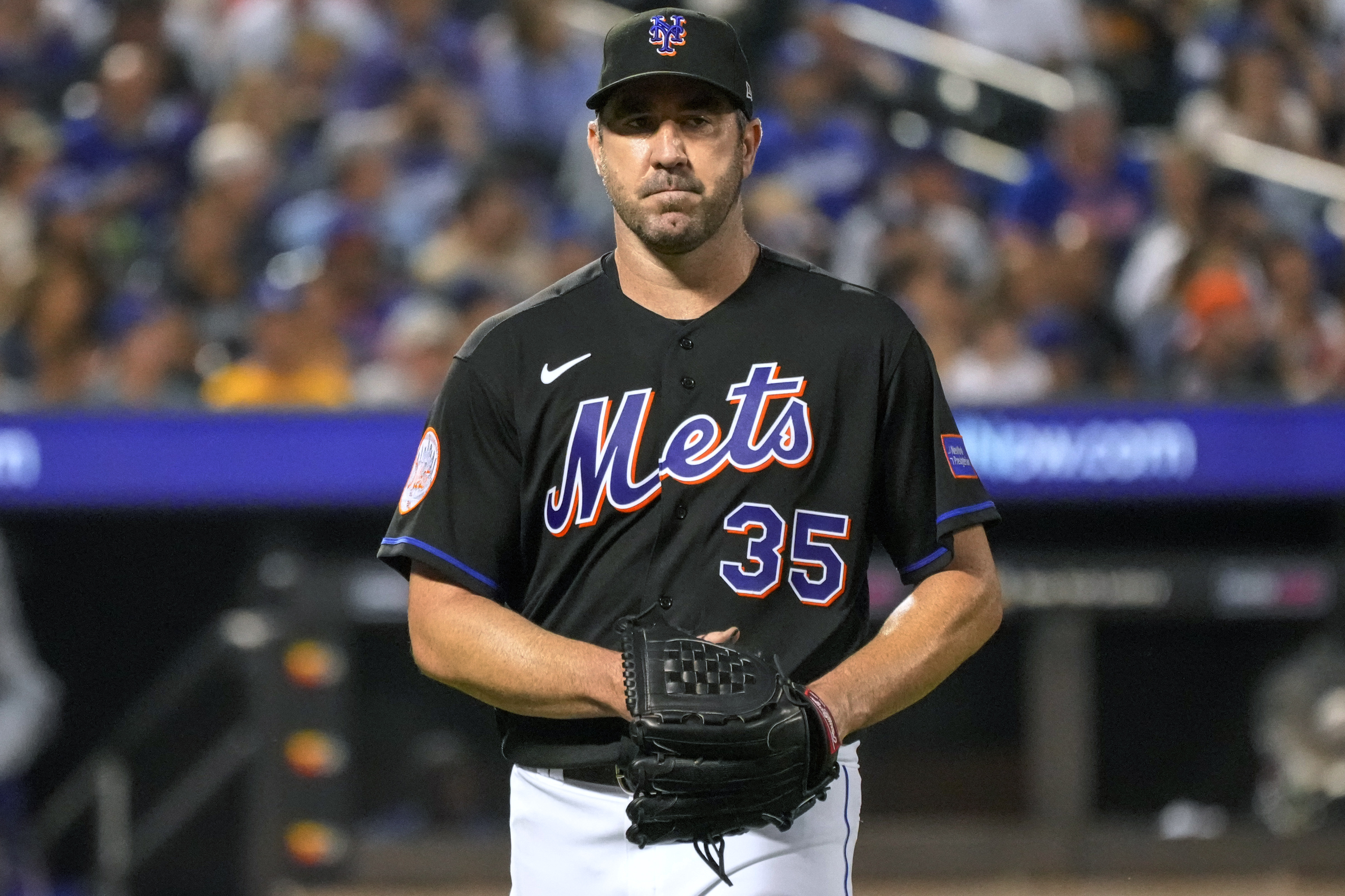 New York Mets pitcher Justin Verlander walks off the field after giving up three runs to the Los Angeles Dodgers during the fifth inning of a baseball game Friday, July 14, 2023, in New York. (AP Photo/Mary Altaffer)