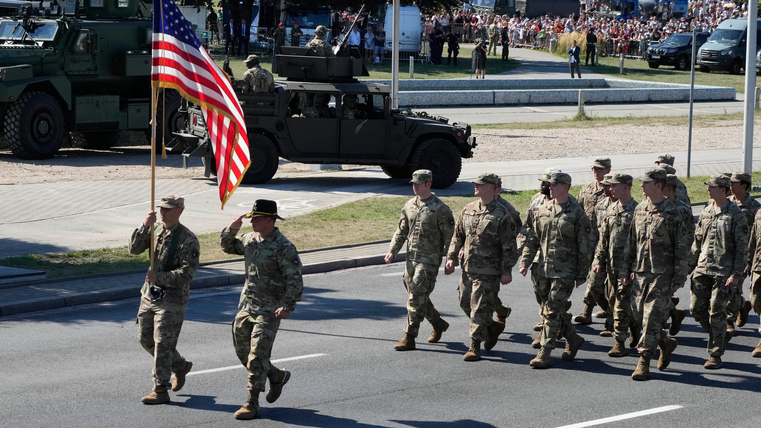 Representative of allied U.S. troops march in a massive military parade to celebrate the Polish Army Day, commemorating the 1920 battle in which Polish troops defeated advancing Bolshevik forces, in Warsaw, Poland, Tuesday, Aug. 15, 2023. Poland is holding a military parade to showcase its state-of-the-art weapons and defense systems, as war rages across its southeastern border in neighboring Ukraine and ahead of parliamentary elections scheduled for Oct. 15. (AP Photo/Czarek Sokolowski)