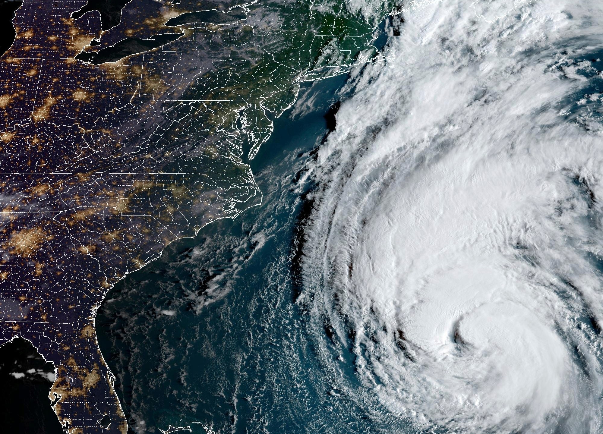 This Thursday, Sept. 14, 2023, 7:51 a.m. EDT satellite image provided by the National Oceanic and Atmospheric Administration shows Hurricane Lee in the Atlantic Ocean. Lee looks poised to wallop New England later this week even as the region still deals with the impact of days of wild weather that produced torrential rain, flooding, sinkholes and a likely tornado. (NOAA via AP)