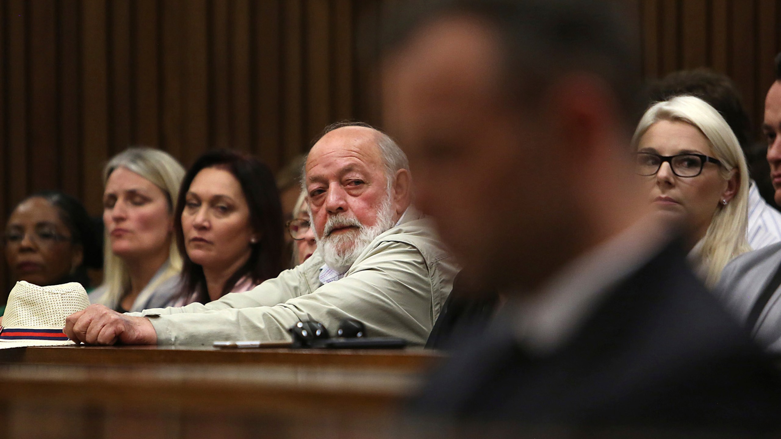 FILE - Barry Steenkamp, back centre, father of Reeva Steenkamp, eyes Oscar Pistorius, foreground, in the High Court in Pretoria, South Africa, Wednesday, June 15, 2016. A family spokesperson says Barry Steenkamp, the father of Reeva Steenkamp, the woman who was fatally shot by Olympic runner Oscar Pistorius, has died. He was 80. Family lawyer and spokesperson Tania Koen confirmed Barry Steenkamp’s death to The Associated Press on Friday, Sept. 15, 2023. (Alon Skuy, Pool Photo via AP, File)