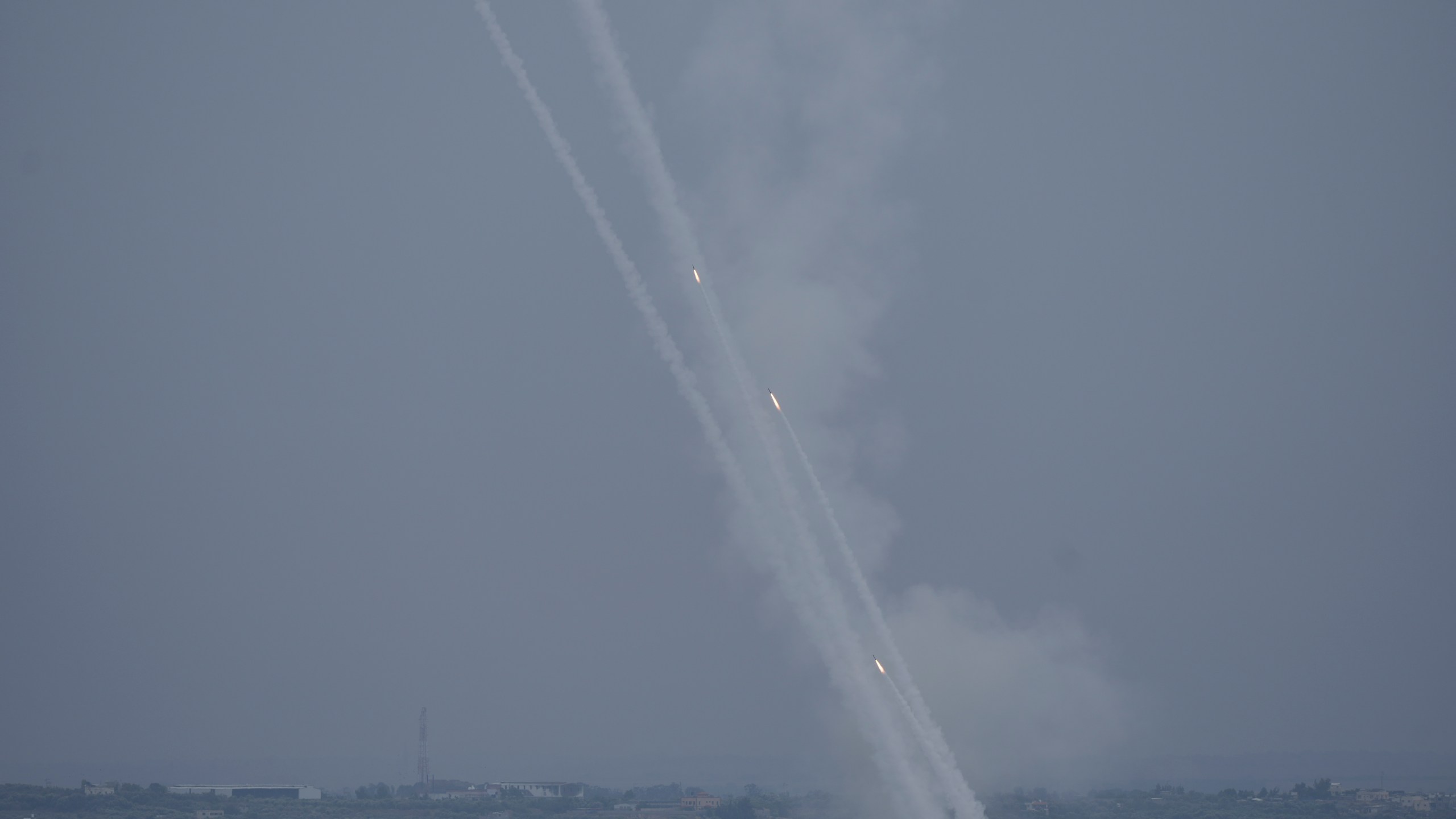 Rockets are fired towards Israel from the Gaza Strip on Monday, Oct. 9, 2023. (AP Photo/Hatem Moussa)