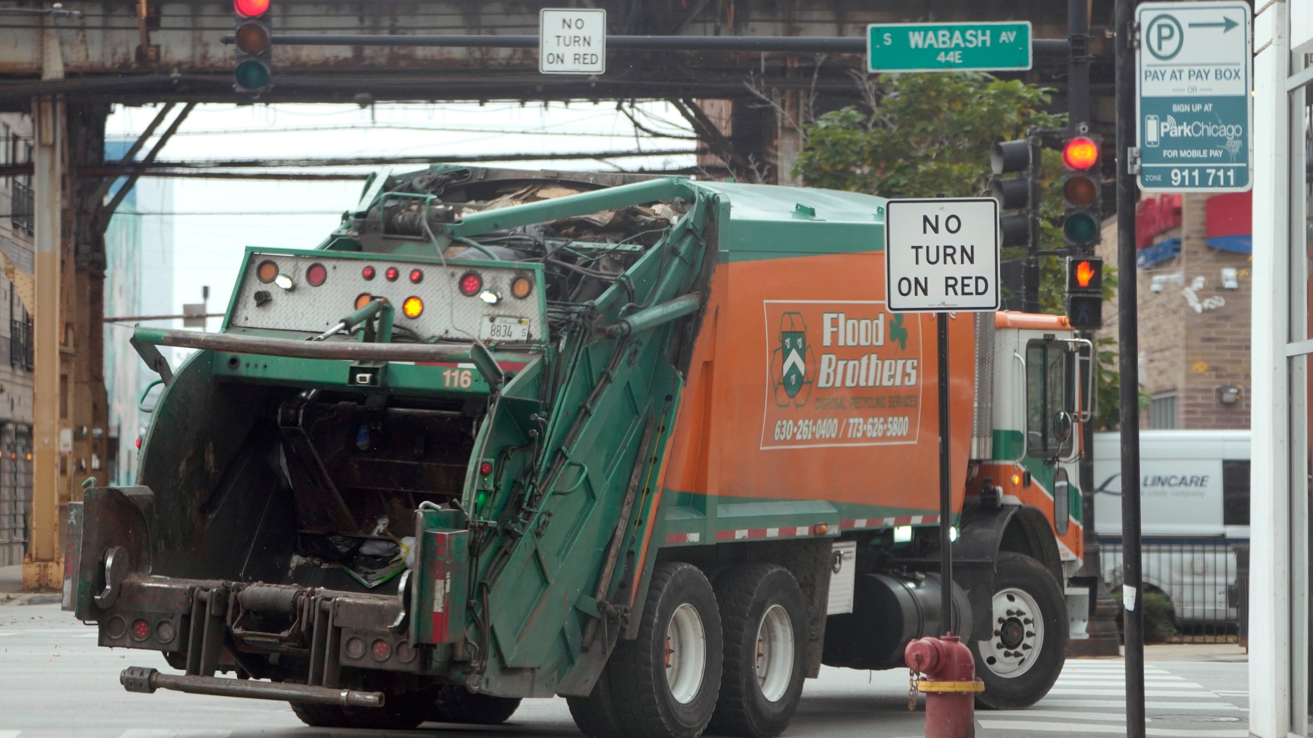 A commercial vehicle makes a right turn on red at an intersection that prohibits the turn Tuesday, Oct. 31, 2023, in Chicago. A dramatic rise in accidents killing or injuring pedestrians and bicyclists has led to a myriad of policy and infrastructure changes, but moves to ban right on red have drawn some of the most intense sentiments on both sides. (AP Photo/Charles Rex Arbogast)