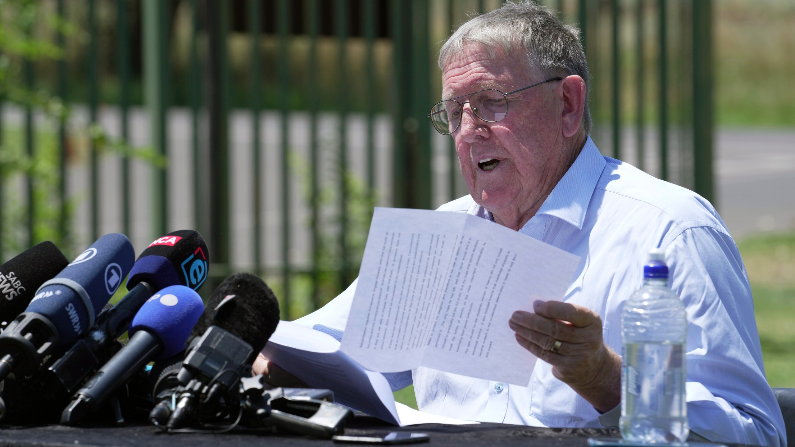 Rob Mathews, the Steenkamp family representative, reads the witness impact statement submitted to the parole body looking into the possible release of Oscar Pistorius, outside the Atteridgeville Prison, in Pretoria, South Africa, Friday, Nov. 24, 2023. The double-amputee Olympic runner was convicted of a charge comparable to third-degree murder for shooting Reeva Steenkamp in his home in 2013. (AP Photo/ Tsvangirayi Mukwazhi)