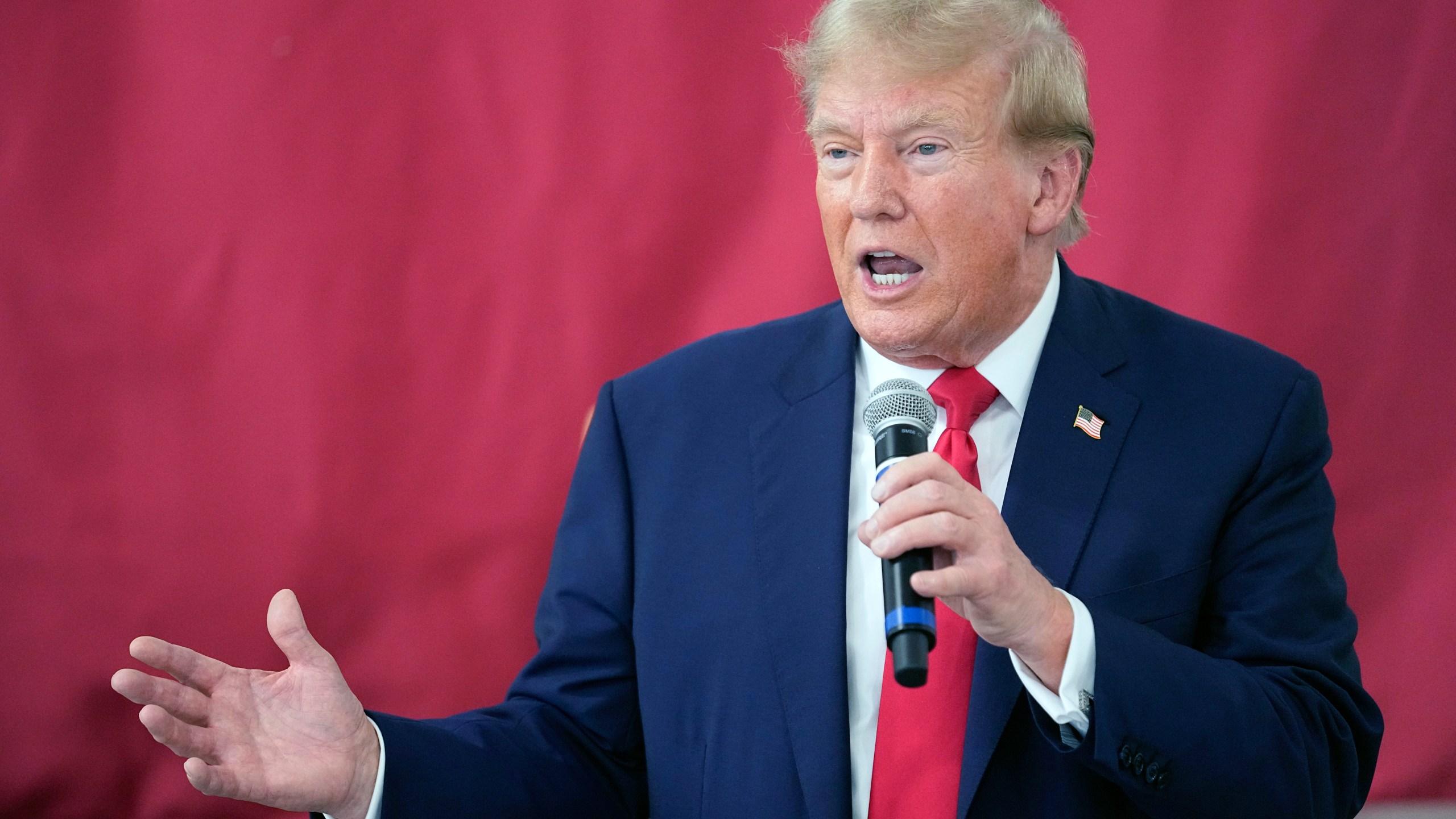 FILE - Republican presidential candidate and former President Donald Trump speaks to Texas state troopers and guardsmen at the South Texas International Airport, Nov. 19, 2023, in Edinburg, Texas. Trump's lawyers are arguing that he had a good faith basis to question the outcome of the 2020 election that he lost. A defense motion filed late Monday in federal court in Washington asserts that Trump was not obligated to accept at face value the judgments of government officials who found no widespread fraud in the election. (AP Photo/Eric Gay, File)