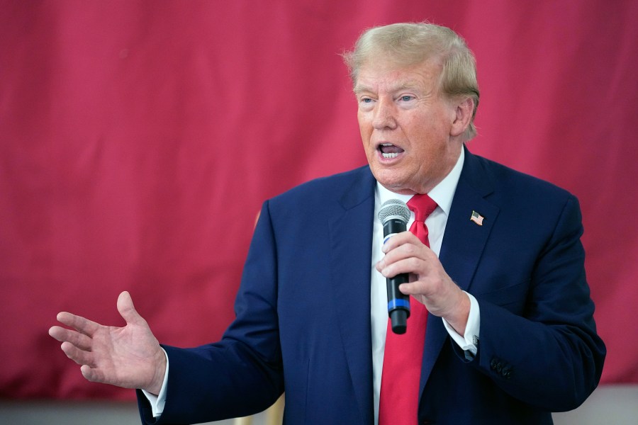 FILE - Republican presidential candidate and former President Donald Trump speaks to Texas state troopers and guardsmen at the South Texas International Airport, Nov. 19, 2023, in Edinburg, Texas. Trump's lawyers are arguing that he had a good faith basis to question the outcome of the 2020 election that he lost. A defense motion filed late Monday in federal court in Washington asserts that Trump was not obligated to accept at face value the judgments of government officials who found no widespread fraud in the election. (AP Photo/Eric Gay, File)