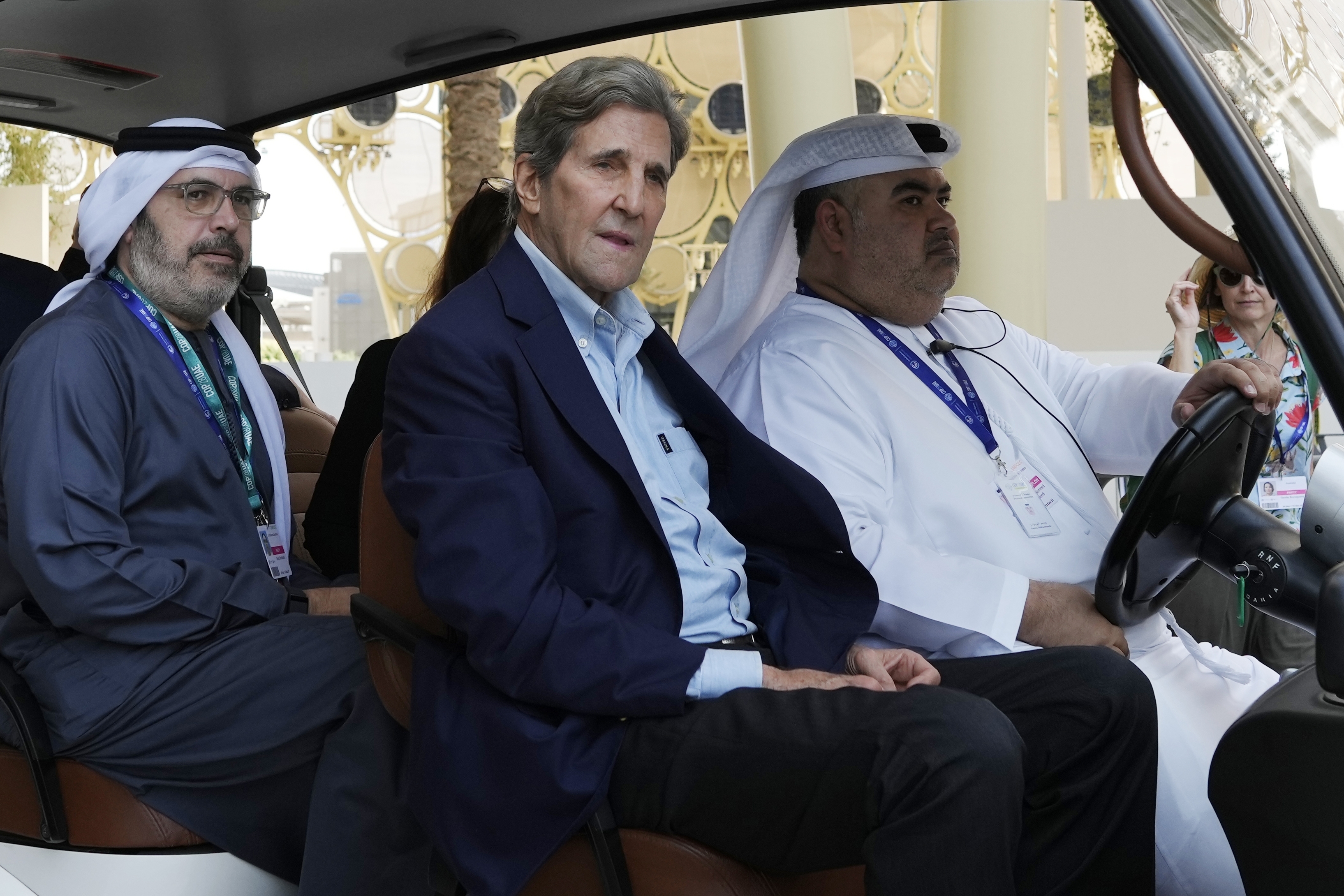 John Kerry, U.S. Special Presidential Envoy for Climate, rides in a cart ahead of the COP28 U.N. Climate Summit, Wednesday, Nov. 29, 2023, in Dubai, United Arab Emirates. (AP Photo/Peter Dejong)