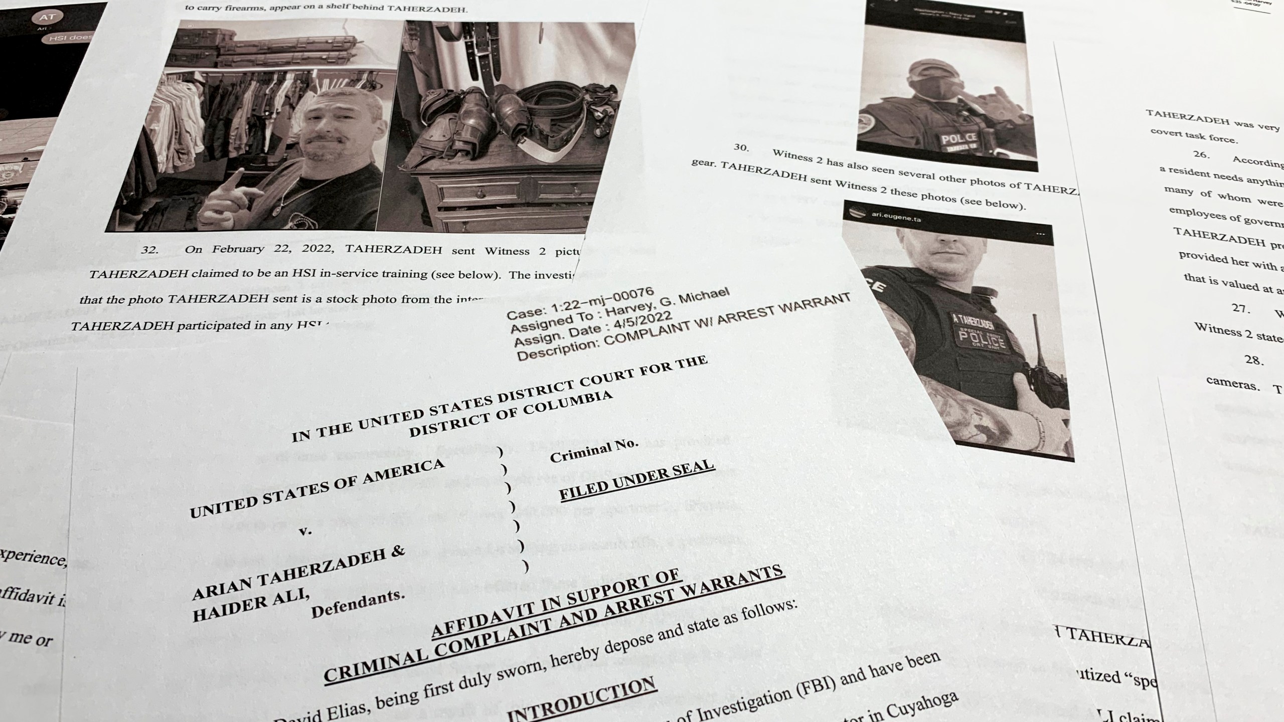 FILE - The affidavit to support the arrest of Arian Taherzadeh and Haider Ali is photographed on April 6, 2022. Taherzadeh, accused of pretending to be a federal agent and offering gifts and free apartments to Secret Service officers, has been sentenced Friday, Dec. 1, 2023, to nearly three years in prison. (AP Photo/Jon Elswick, File)