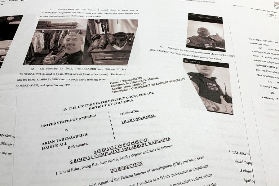 FILE - The affidavit to support the arrest of Arian Taherzadeh and Haider Ali is photographed on April 6, 2022. Taherzadeh, accused of pretending to be a federal agent and offering gifts and free apartments to Secret Service officers, has been sentenced Friday, Dec. 1, 2023, to nearly three years in prison. (AP Photo/Jon Elswick, File)