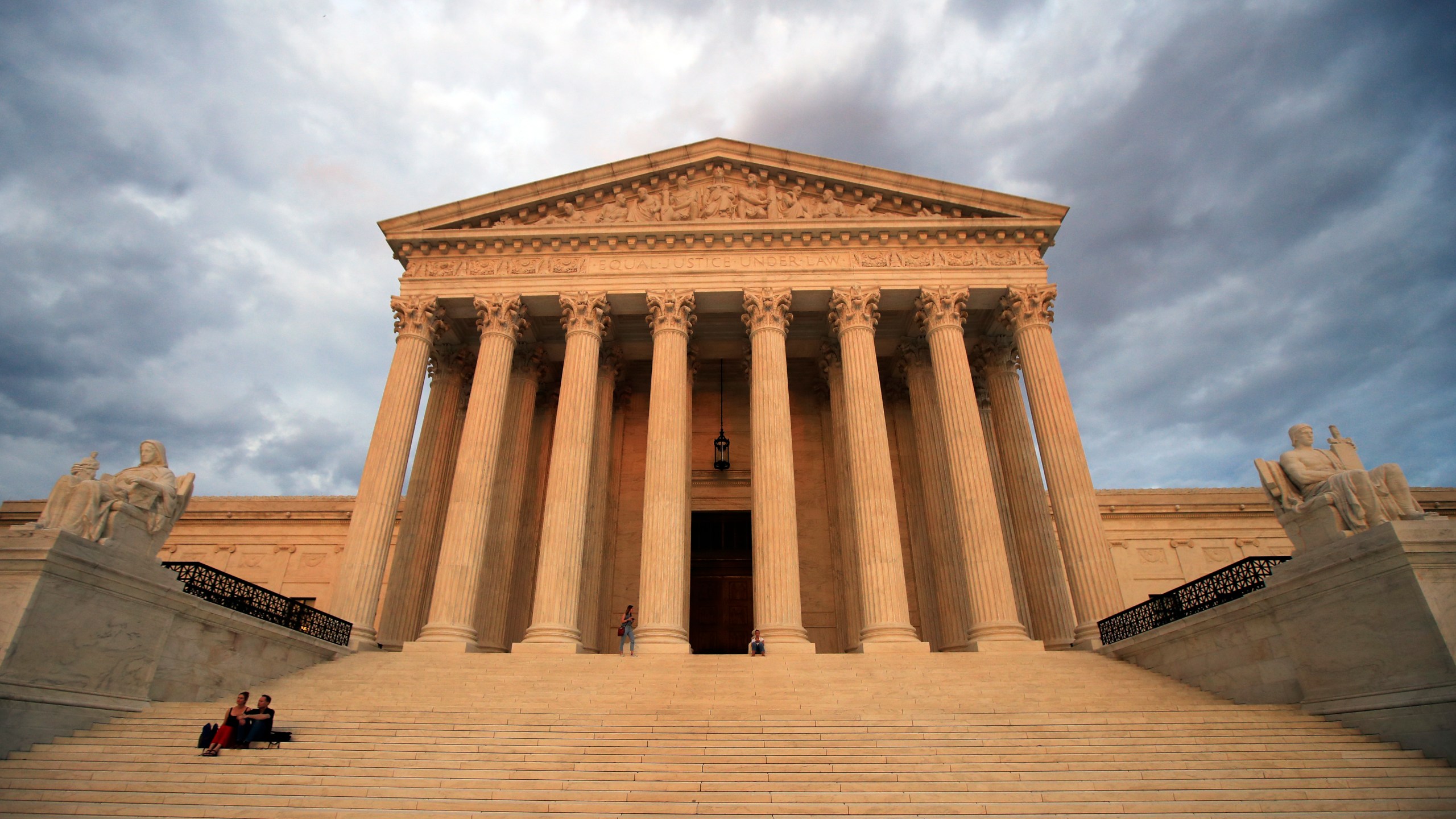 FILE - The U.S. Supreme Court is seen at near sunset in Washington, on Oct. 18, 2018. The Supreme Court is hearing arguments in a challenge to the Securities and Exchange Commission's ability to fight fraud, part of a broader attack on regulatory agencies led by conservative and business interests. (AP Photo/Manuel Balce Ceneta, File)