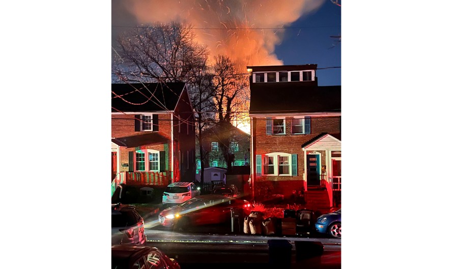 A home is seen exploding from a distance, Monday night, Dec. 4, 2023 in Arlington, Va. Arlington County Police in a Virginia suburb of the nation’s capital are investigating an explosion at a residence where officers were trying to serve a search warrant Monday. The Arlington County Police Department said in a statement that the suspect fired several shots inside the home and that an explosion happened. Arlington is located across the Potomac River from Washington, D.C. (AP Photo)