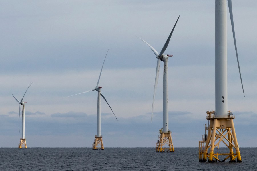 The five turbines of Block Island Wind Farm operate, Thursday, Dec. 7, 2023, off the coast of Block Island, R.I., during a tour of the North Fork Wind farm organized by Orsted. (AP Photo/Julia Nikhinson)