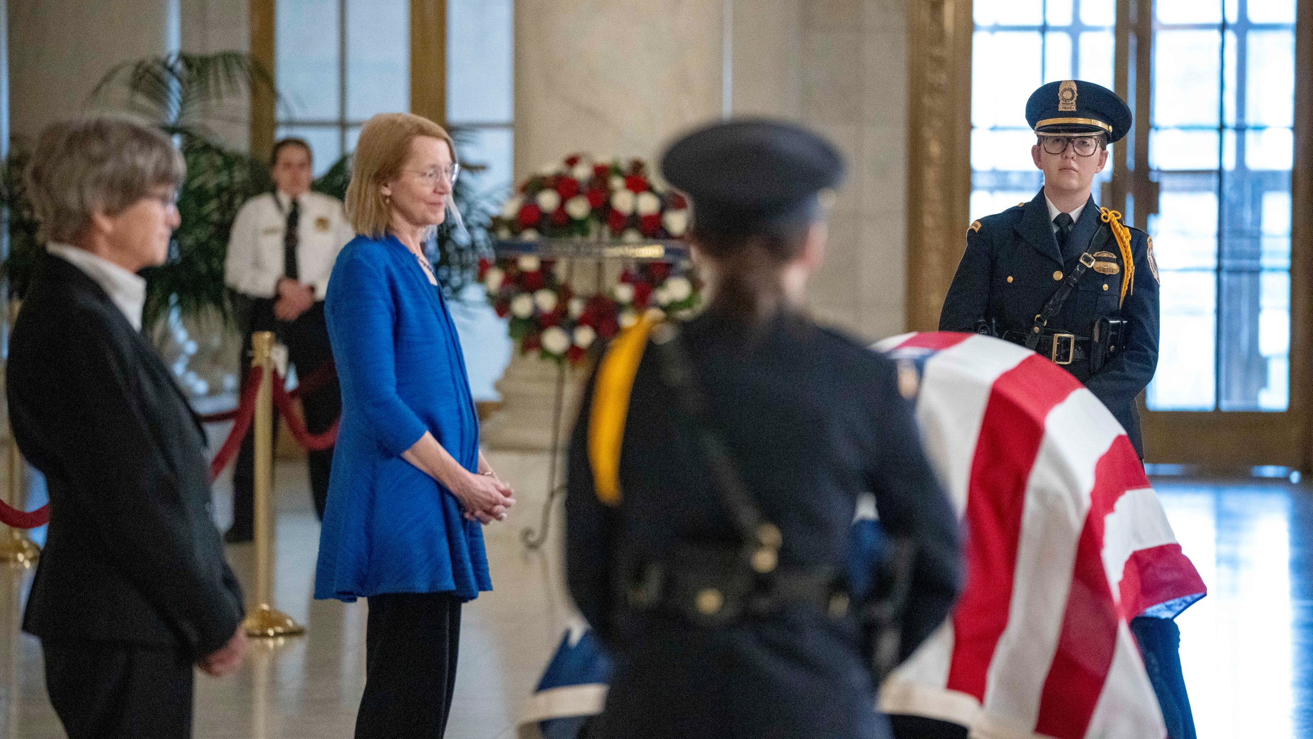 Former law clerks for retired Supreme Court Justice Sandra Day O'Connor stand at the casket during public repose in the Great Hall at the Supreme Court in Washington, Monday, Dec. 18, 2023. O'Connor, a Arizona native and the first woman to serve on the nation's highest court, died Dec. 1 at age 93. (AP Photo/Alex Brandon)