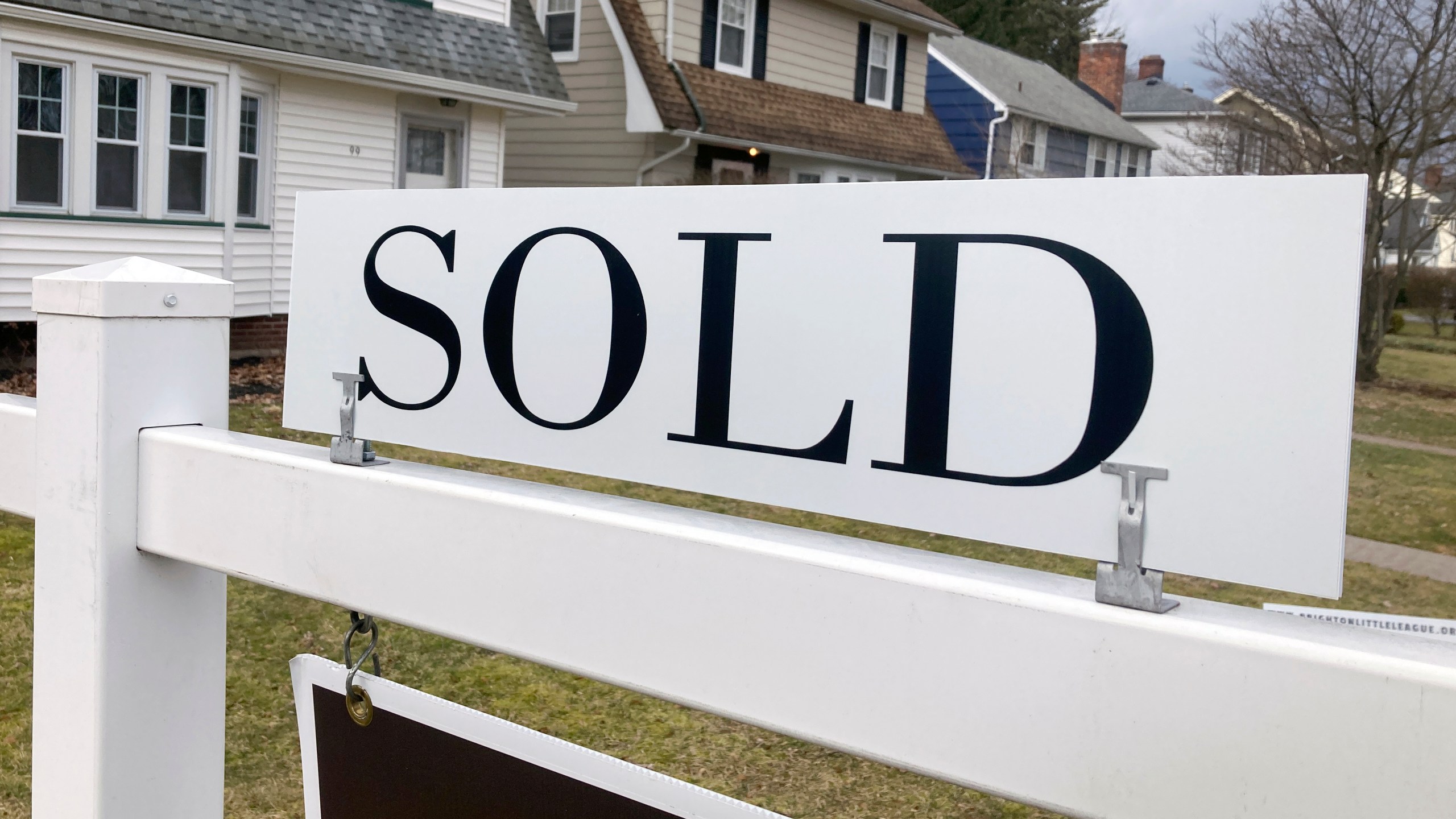 FILE - A sold sign hangs in front of a Brighton, New York house on Tuesday, February 21, 2023. The average rate on a 30-year mortgage rose to 6.66% from 6.62% last week, mortgage buyer Freddie Mac said Thursday, Jan. 11, 2024. (AP Photo/Ted Shaffrey, File)