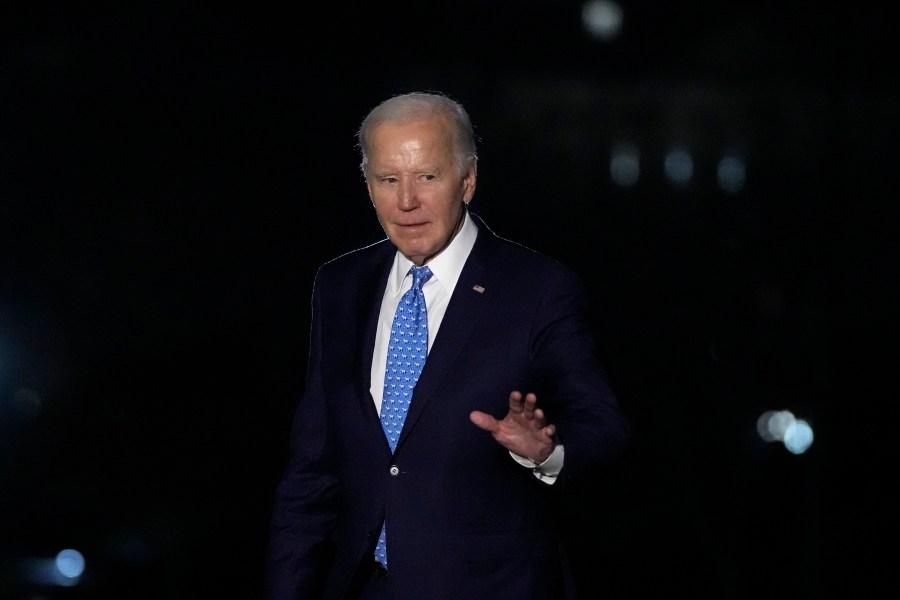 President Joe Biden waves as he walks across the South Lawn of the White House in Washington, Tuesday, Jan. 30, 2024, after returning from a trip to Florida. (AP Photo/Susan Walsh)