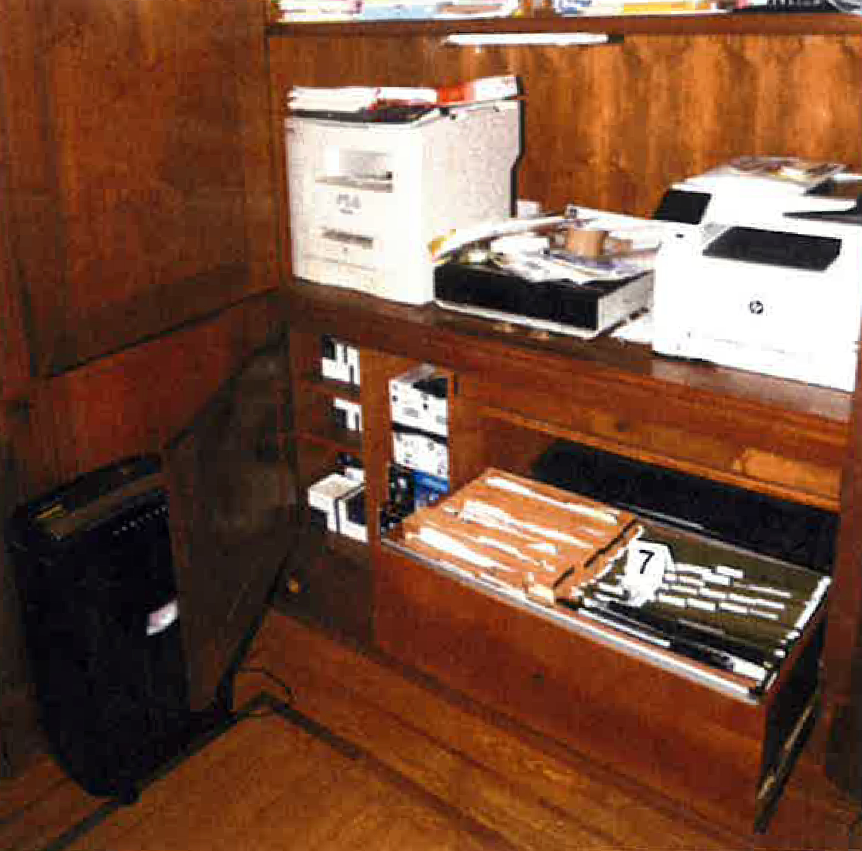 This image, contained in the report from special counsel Robert Hur, shows notebooks in a file cabinet under a printer that were seized in first-floor home office of President Joe Biden in Wilmington, Del., on Jan. 20, 2023, during a search by FBI agents. (Justice Department via AP)