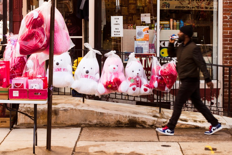 FILE - A pedestrian passes Valentine's day stuffed animals for sale ahead of the holiday in Philadelphia, Feb. 13, 2019. This is the first Valentine's Day since the U.S. surgeon general issued a public health advisory declaring loneliness and isolation an epidemic with dire consequences. (AP Photo/Matt Rourke, file)