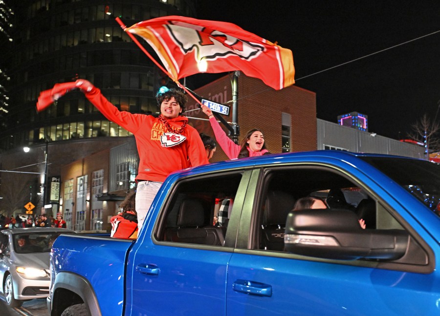 Kansas City Chiefs fans celebrate after the Chiefs beat the San Francisco 49ers in the Super Bowl, at the Power and Light District, Sunday, Feb. 11, 2024, in Kansas City, Mo. (AP Photo/Peter Aiken)