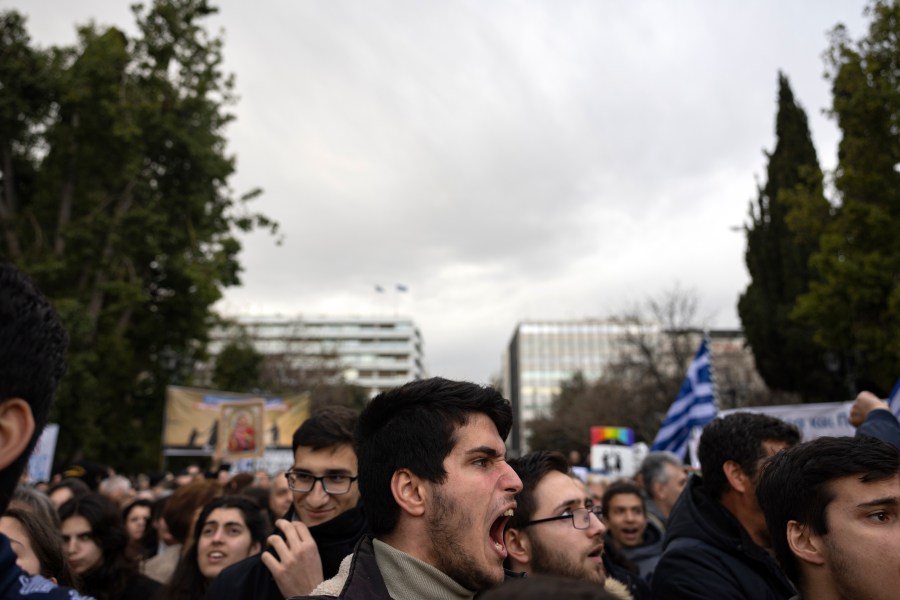 A protester shouts slogans during a rally against same-sex marriage, at central Syntagma Square, in Athens, Greece, Sunday, Feb. 11, 2024. Lawmakers begin a debate Wednesday on a landmark bill to legalize same-sex marriage that would make Greece the first Orthodox Christian country to do so. (AP Photo/Yorgos Karahalis)