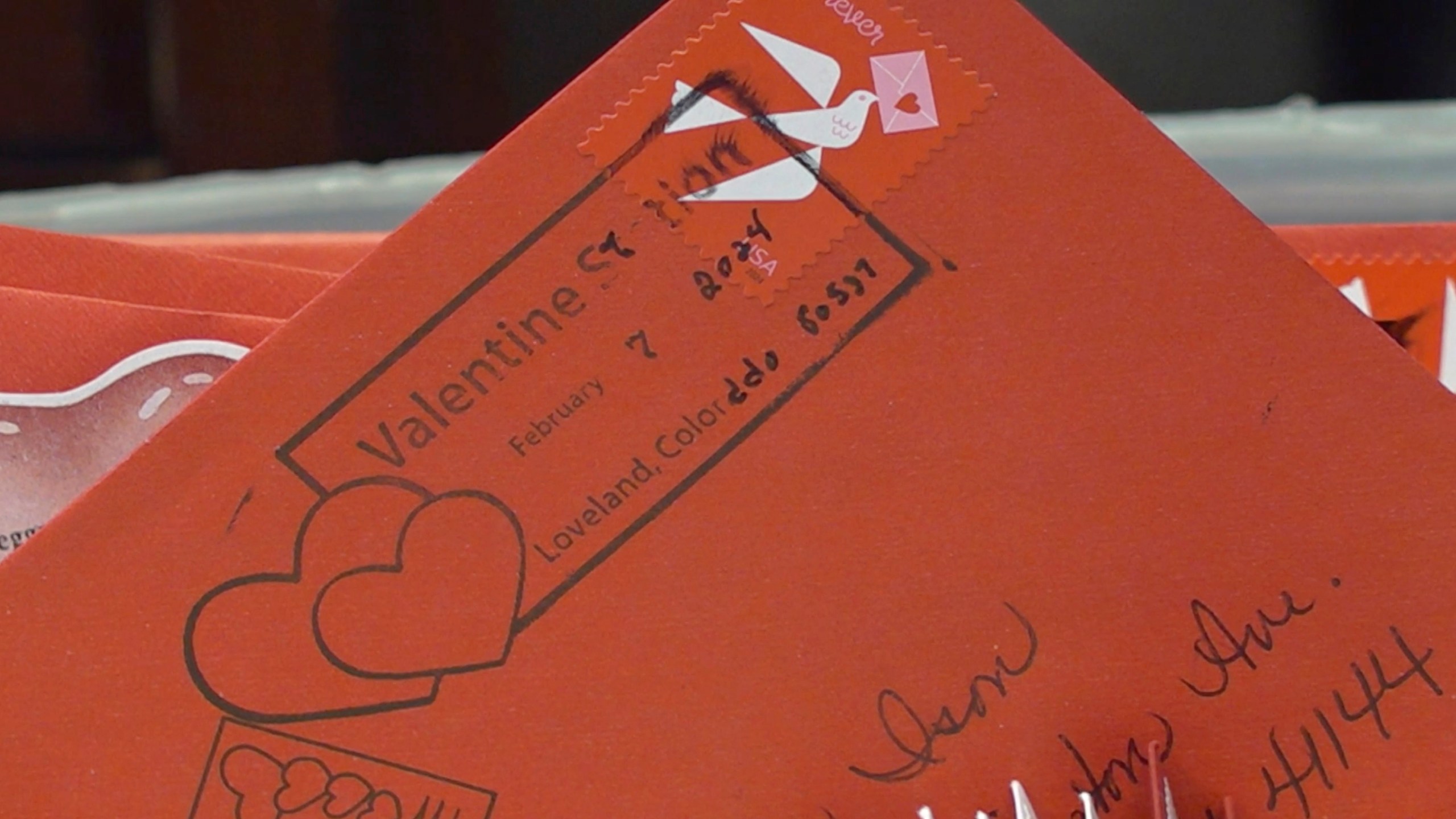 A special cancellation postmark is seen on a Valentine’s Day card in Loveland, Colo., on Wednesday, Feb. 7, 2024. Every year, tens of thousands of people from around the world route their Valentine’s Day cards to the “Sweetheart City” to get an inscription and the coveted Loveland postmark. The re-mailing tradition has been going on for nearly 80 years and is the largest of its kind in the world. (AP Photo/Thomas Peipert)