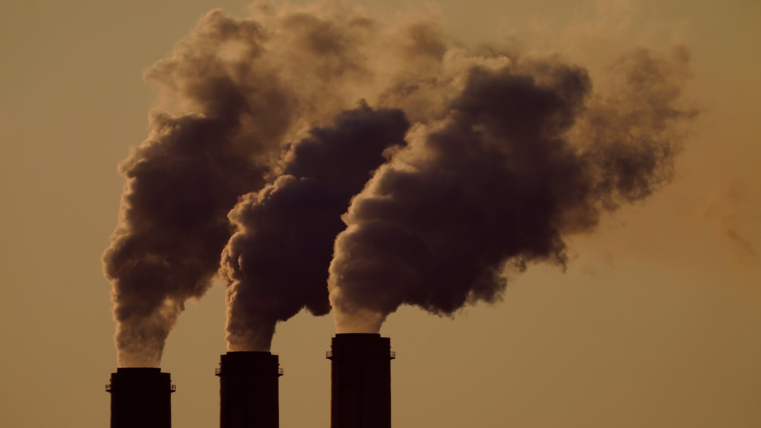 FILE - Emissions rise from the smokestacks at the Jeffrey Energy Center coal power plant as the suns sets, near Emmett, Kan., Sept. 18, 2021. The Supreme Court's conservative majority seemed skeptical Wednesday, Feb. 21, 2024, as a government lawyer argued that the Environmental Protection Agency should be allowed to continue enforcing its anti-air-pollution "good neighbor'' rule. (AP Photo/Charlie Riedel, File)