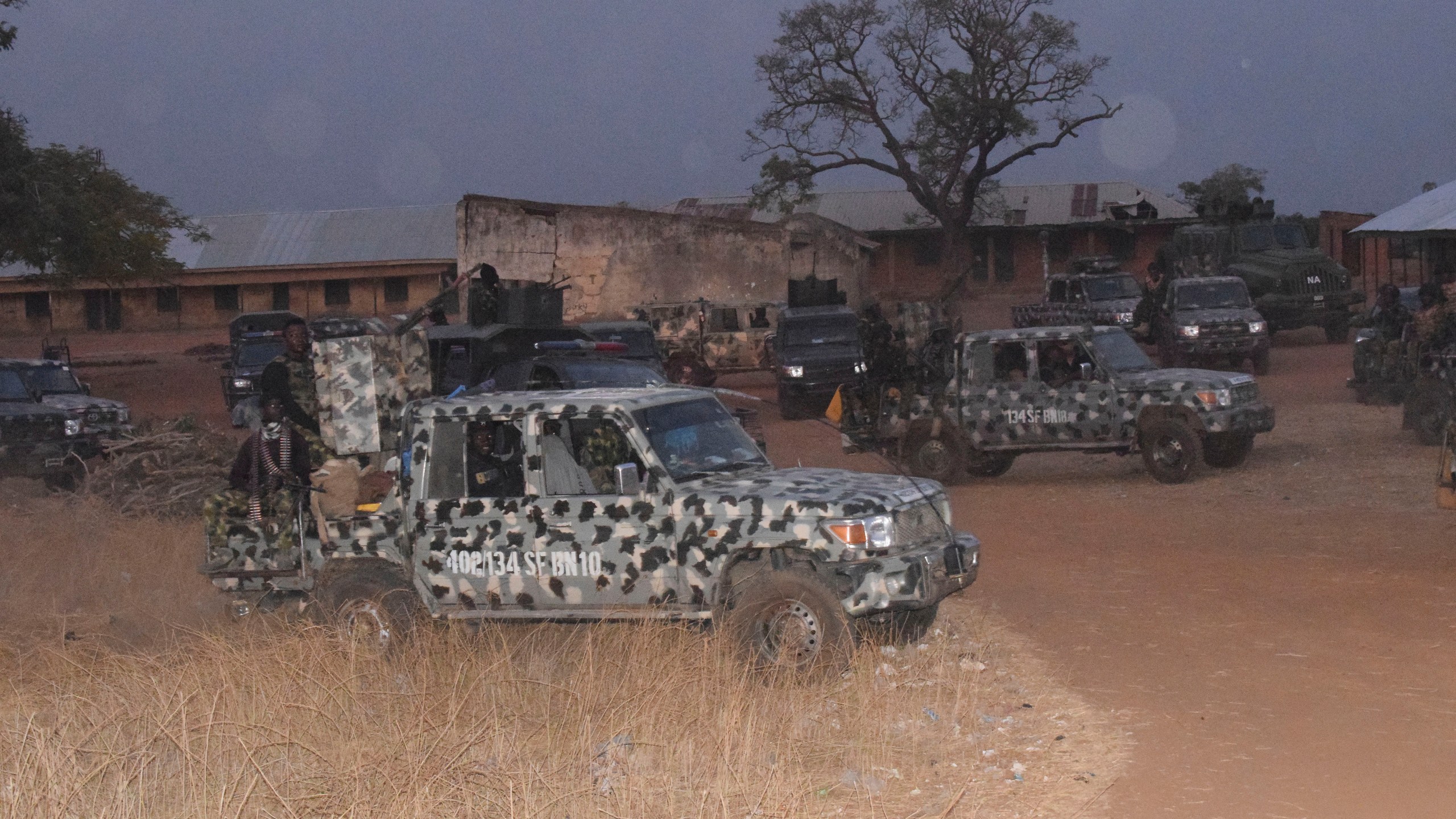 Nigeria army trucks are park in an area were gunmen kidnapped school children in Chikun, Nigeria, Thursday, March. 7, 2024. Gunmen attacked a school in Nigeria's northwest region Thursday morning and abducted at least 287 students, the headteacher told authorities, marking the second mass abduction in the West African nation in less than a week. (AP Photo)