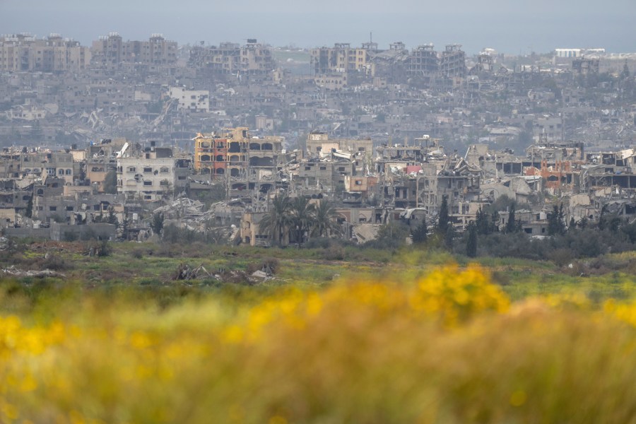 Destroyed buildings stand in the Gaza Strip as seen from southern Israel, Monday, March 18, 2024. (AP Photo/Ohad Zwigenberg)