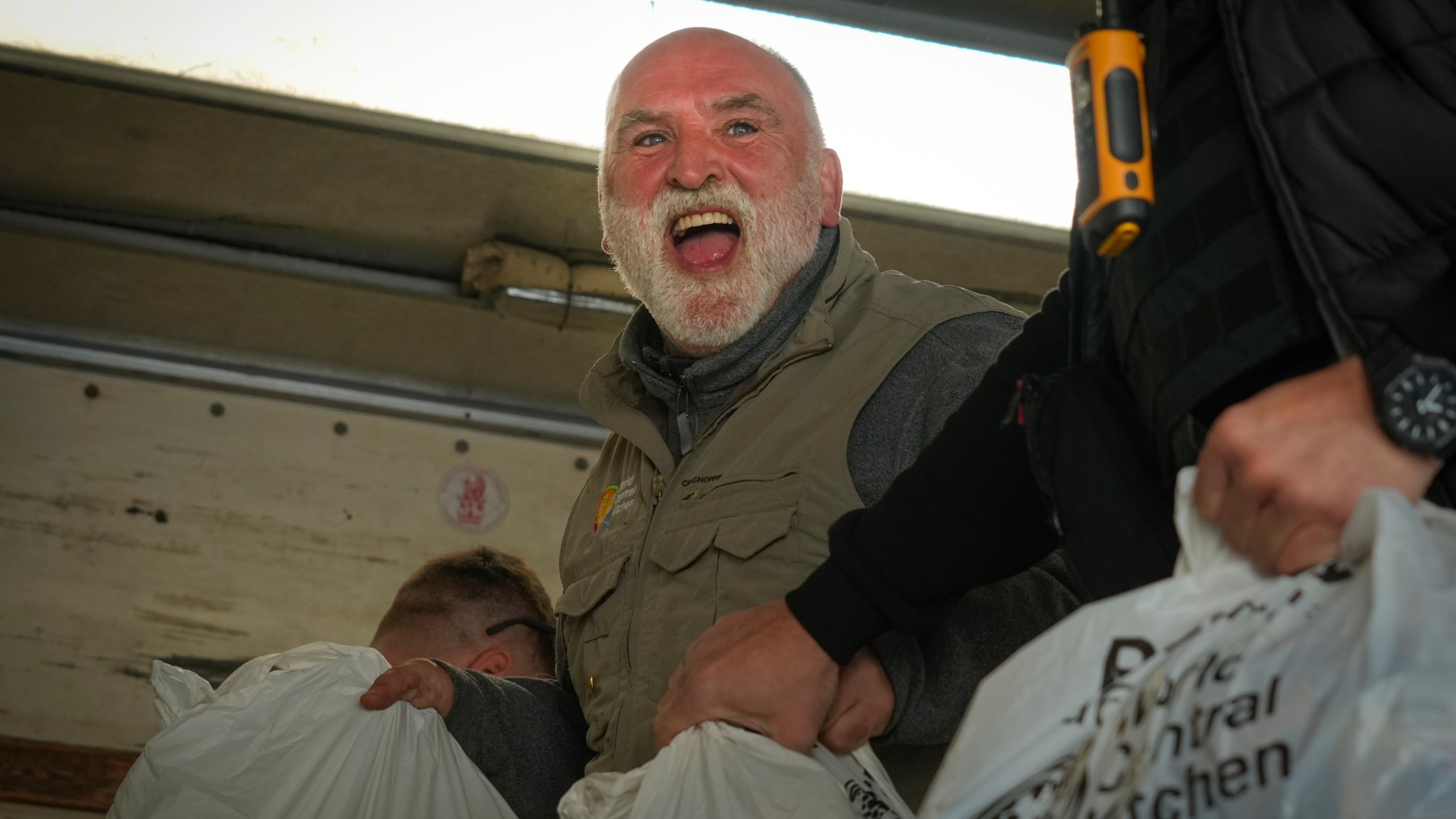 FILE - Jose Andres, a Spanish chef, and founder of World Central Kitchen unloads the humanitarian food packages delivered with WCK's truck in Kherson, Ukraine, on Nov. 15, 2022. World Central Kitchen, called a halt to its work in the Gaza Strip after an apparent Israeli strike killed seven of its workers, mostly foreigners. (AP Photo/Efrem Lukatsky, File)