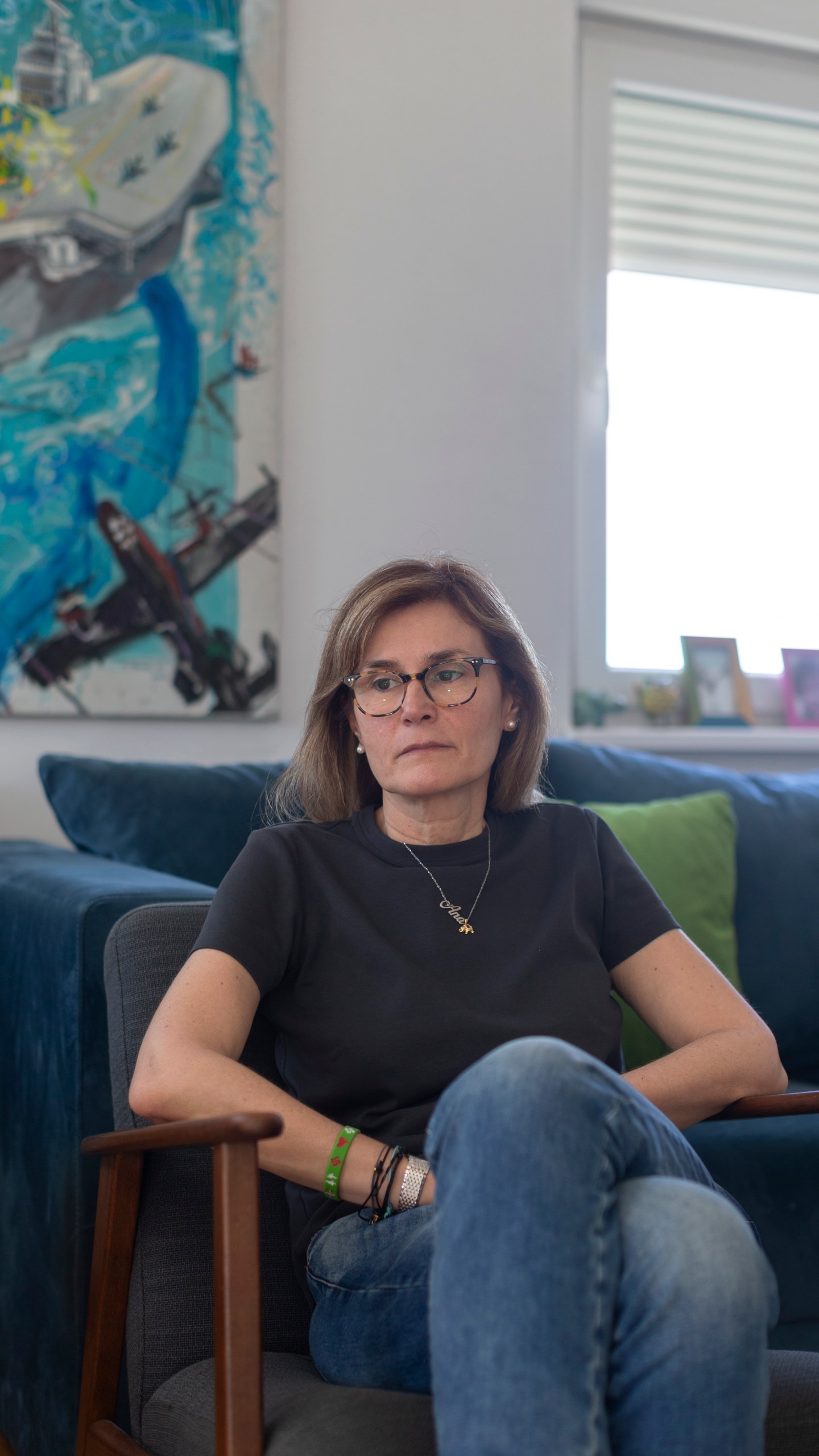 In this photo taken on Saturday, April 27, 2024, Ninela Radicevic, 49, the mother of Ana Bozovic, a slain elementary school student, sits in her living room in Belgrade, Serbia. The 11-year-old Ana Bozovic had just arrived to her school in central Belgrade last year when another pupil, 13 at the time, came in and opened fire at anyone standing in his way. A total of 10 people were killed. (AP Photo/Marko Drobnjakovic)