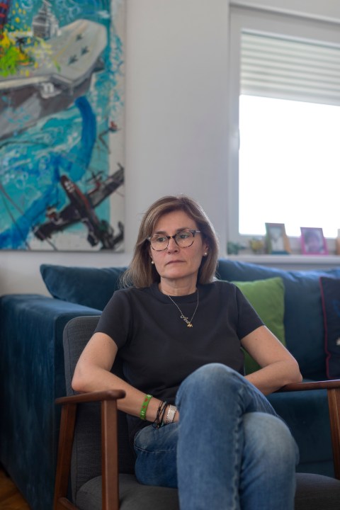 In this photo taken on Saturday, April 27, 2024, Ninela Radicevic, 49, the mother of Ana Bozovic, a slain elementary school student, sits in her living room in Belgrade, Serbia. The 11-year-old Ana Bozovic had just arrived to her school in central Belgrade last year when another pupil, 13 at the time, came in and opened fire at anyone standing in his way. A total of 10 people were killed. (AP Photo/Marko Drobnjakovic)