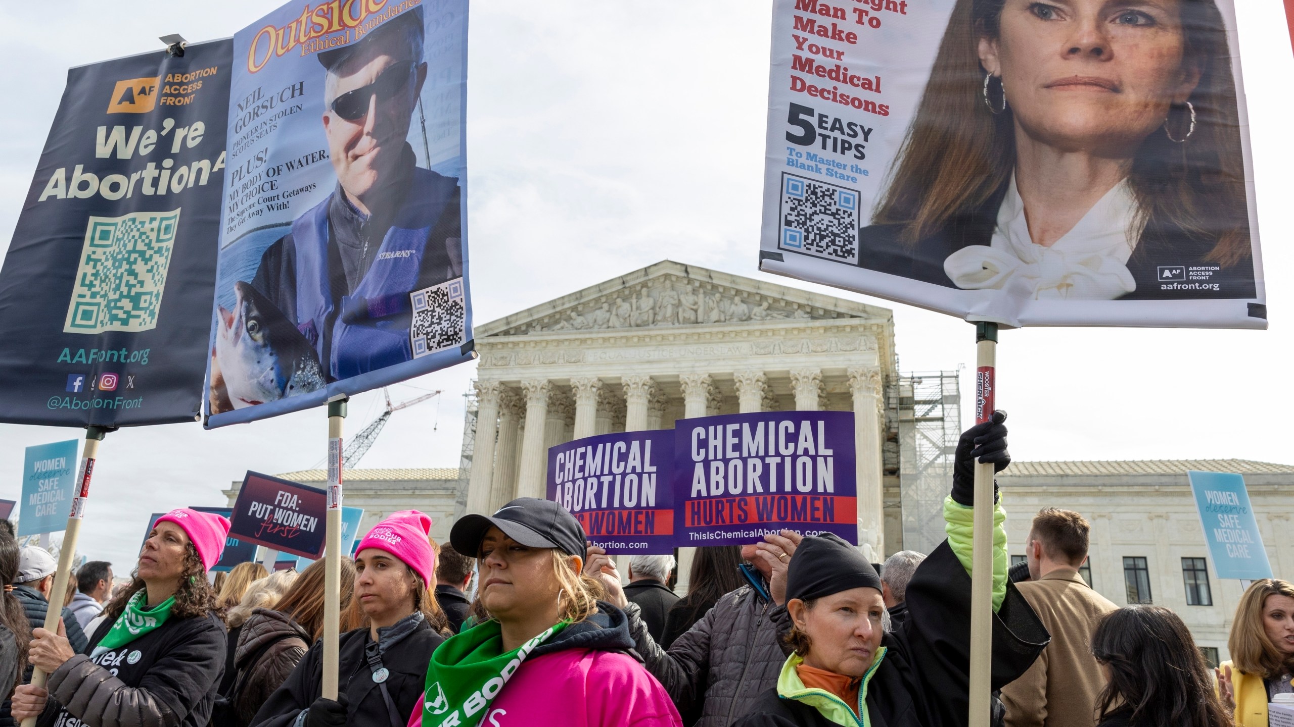 FILE - Anti-abortion and Abortion-rights activists rally outside the Supreme Court, Tuesday, March 26, 2024, in Washington. Two years after a leaked draft of a U.S. Supreme Court opinion singled that the nation's abortion landscape was about to shift dramatically, the issue is still consuming the nation's courts, legislatures and political campaigns and changing the course of lives. (AP Photo/Amanda Andrade-Rhoades, File)