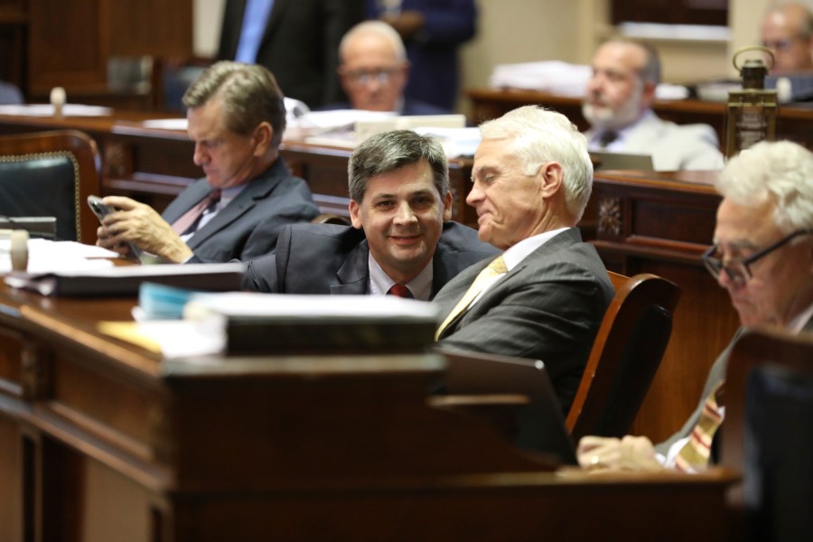 South Carolina Senate Majority Leader Shane Massey, R-Edgefield, left, and Sen. Chip Campsen, R-Isle of Palms, right, talk as the Senate debates a bill that would ban gender-affirming care for transgender minors on Wednesday, May 1, 2024, in Columbia, S.C. (AP Photo/Jeffrey Collins)