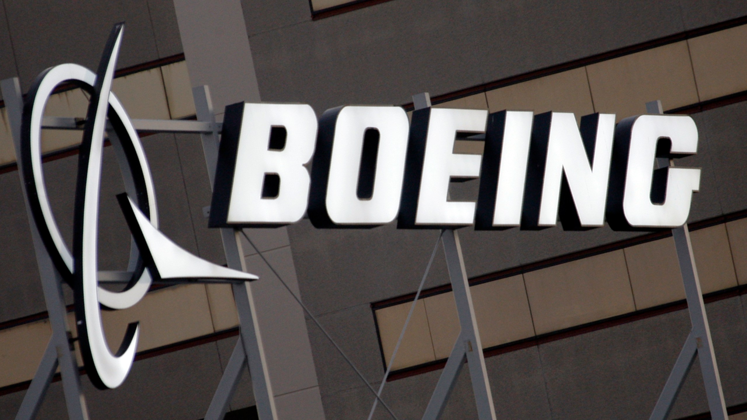 FILE - The Boeing logo is seen, Jan. 25, 2011, on the property in El Segundo, Calif. Boeing is threatening to lock out its private force of firefighters who protect its aircraft-manufacturing plants in the Seattle area Friday night, May 3, 2024, unless the workers accept the company's last offer on wages. (AP Photo/Reed Saxon, File)