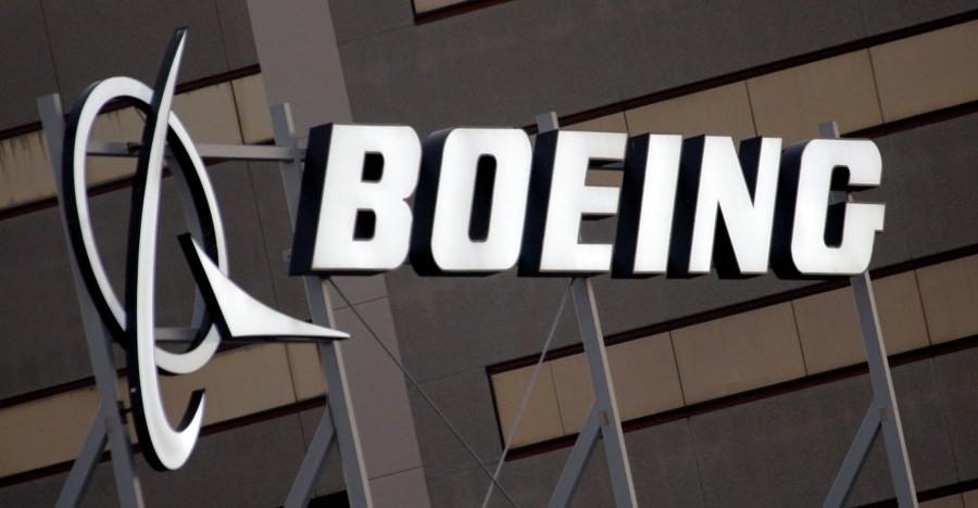 FILE - The Boeing logo is seen, Jan. 25, 2011, on the property in El Segundo, Calif. Boeing is threatening to lock out its private force of firefighters who protect its aircraft-manufacturing plants in the Seattle area Friday night, May 3, 2024, unless the workers accept the company's last offer on wages. (AP Photo/Reed Saxon, File)