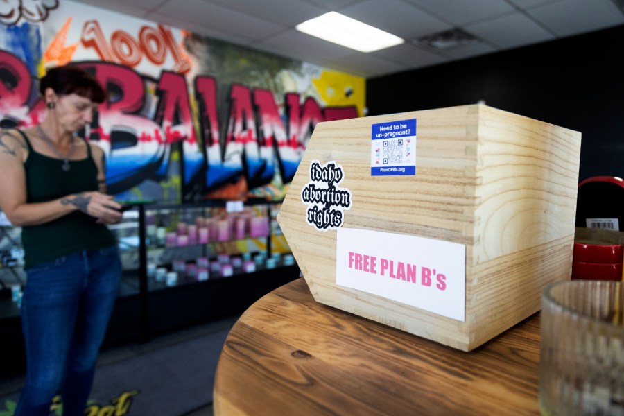 Jen Martindale delivers reproductive health materials to The Honey Pot CBD store in Boise, Idaho, on Saturday, April 13, 2024. The materials are part of kits which include condoms, dental dams, emergency contraceptives, along with sexual and reproductive healthcare pamphlets and are offered for free to businesses in Boise and surrounding areas of Idaho. (AP Photo/Kyle Green)