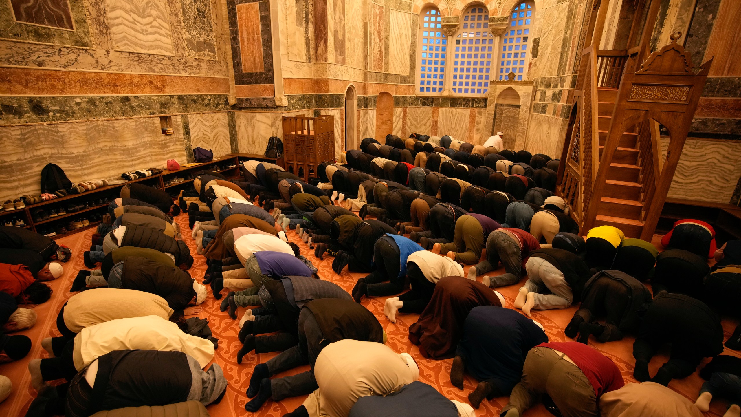 Muslim worshippers perform evening prayer in a former Byzantine church which formally opened as a mosque, in Istanbul, Turkey, Monday, May 6, 2024. Turkish President Recep Tayyip Erdogan formally opened a former Byzantine church in Istanbul as a mosque on Monday, four years after his government had designated it a Muslim house of prayer, despite criticism from neighboring Greece. (AP Photo/Emrah Gurel)