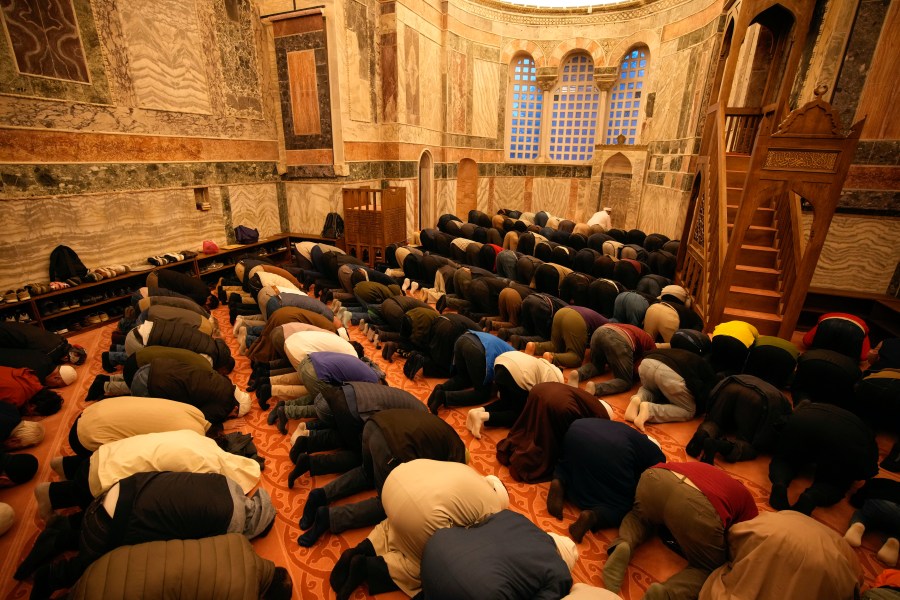 Muslim worshippers perform evening prayer in a former Byzantine church which formally opened as a mosque, in Istanbul, Turkey, Monday, May 6, 2024. Turkish President Recep Tayyip Erdogan formally opened a former Byzantine church in Istanbul as a mosque on Monday, four years after his government had designated it a Muslim house of prayer, despite criticism from neighboring Greece. (AP Photo/Emrah Gurel)