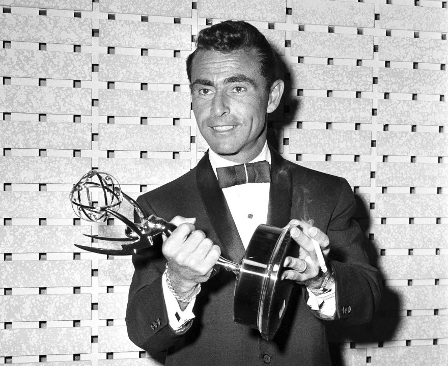 FILE - Writer Rod Serling holds the Emmy for best writing of a drama series for his work on "The Twilight Zone," at the Emmy Awards in Los Angeles on May 16, 1961. (AP Photo, File)