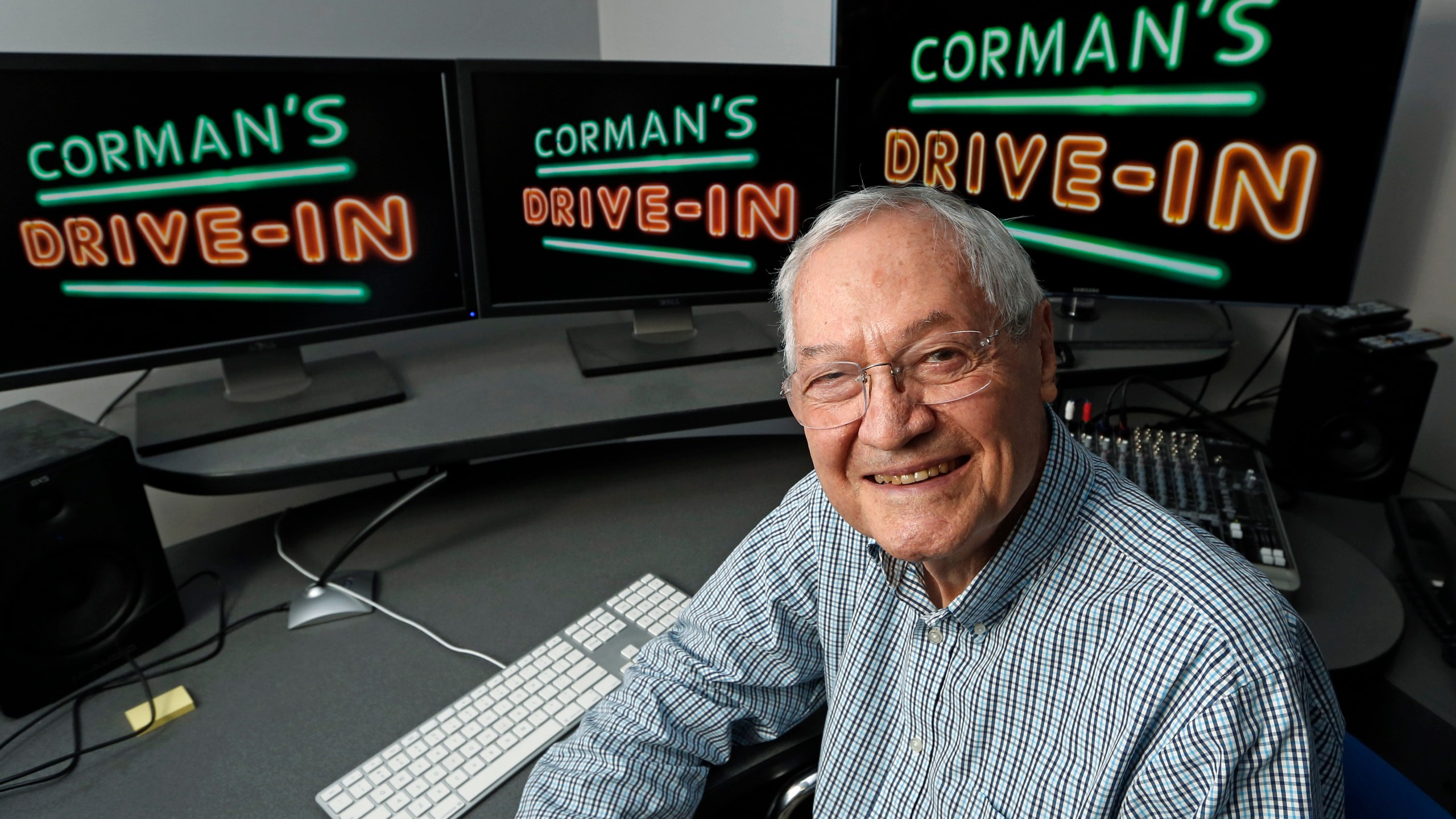 FILE - Producer Roger Corman poses in his Los Angeles office, May 8, 2013. Corman, the Oscar-winning “King of the Bs” who helped turn out such low-budget classics as “Little Shop of Horrors” and “Attack of the Crab Monsters” and gave many of Hollywood's most famous actors and directors an early break, died Thursday, May 9, 2024. He was 98. (AP Photo/Reed Saxon, File)