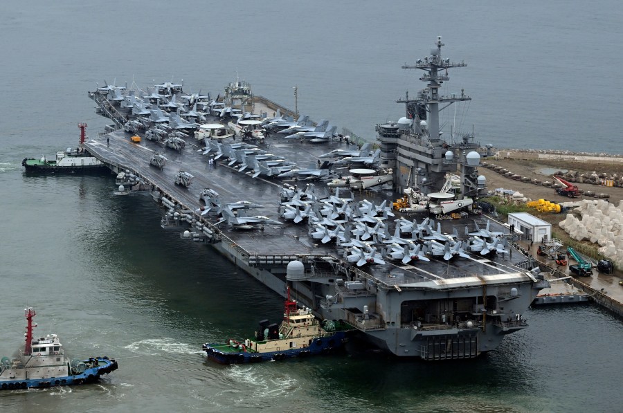 The Theodore Roosevelt (CVN 71), a nuclear-powered aircraft carrier is anchored in Busan, South Korea, Saturday, June 22, 2024. (Song Kyung-Seok/Pool Photo via AP)