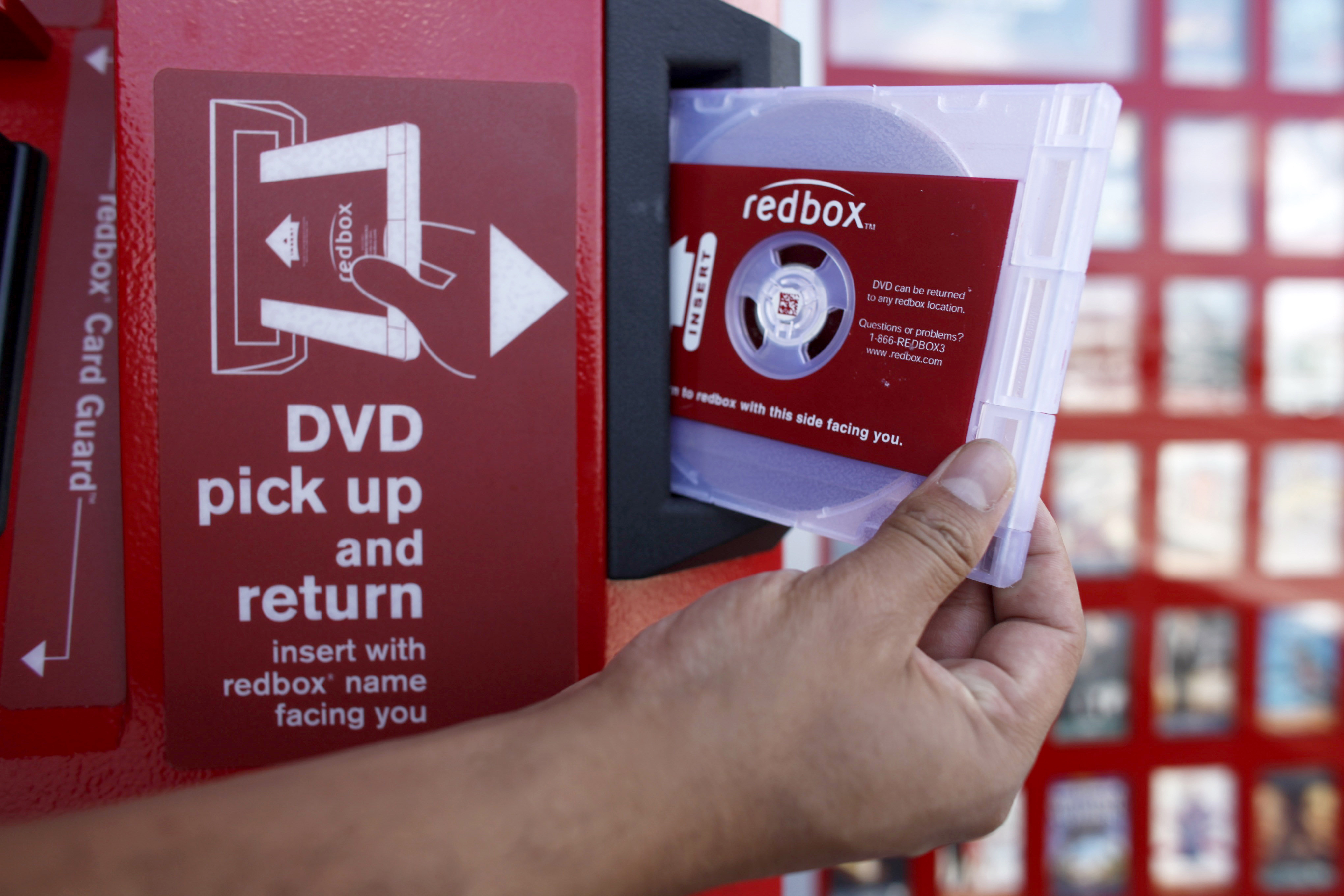 FILE - A rental DVD is dispensed from a Redbox at a 7-Eleven in Los Angeles on August 7, 2009. Chicken Soup for the Soul Entertainment, the owner of DVD rental operator Redbox, filed for Chapter 11 bankruptcy protection, Friday, June 28, 2024. (AP Photo/Damian Dovarganes, File)