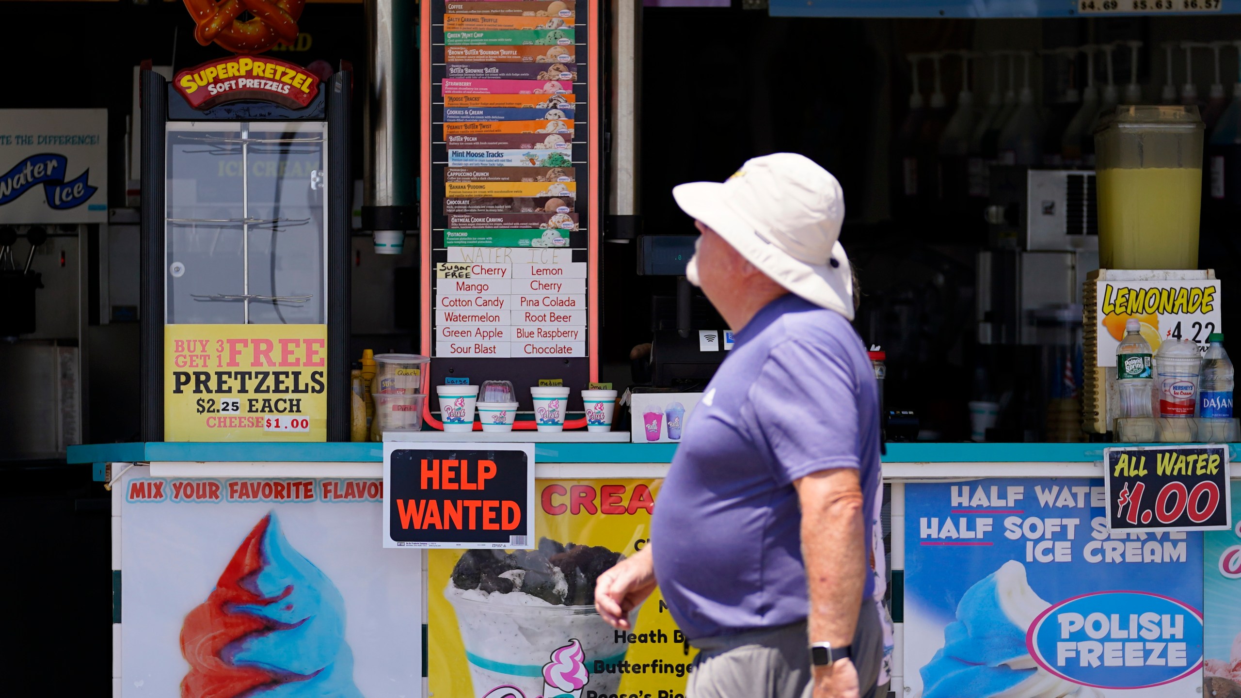 FILE - A person walks past an ice cream stand on the boardwalk, Thursday, June 2, 2022, in Ocean City, N.J. A type of bankruptcy protection filing that made it easier for small businesses to seek relief has expired, which will complicate filing for small businesses with more than $3 million in debt. (AP Photo/Matt Slocum, File)